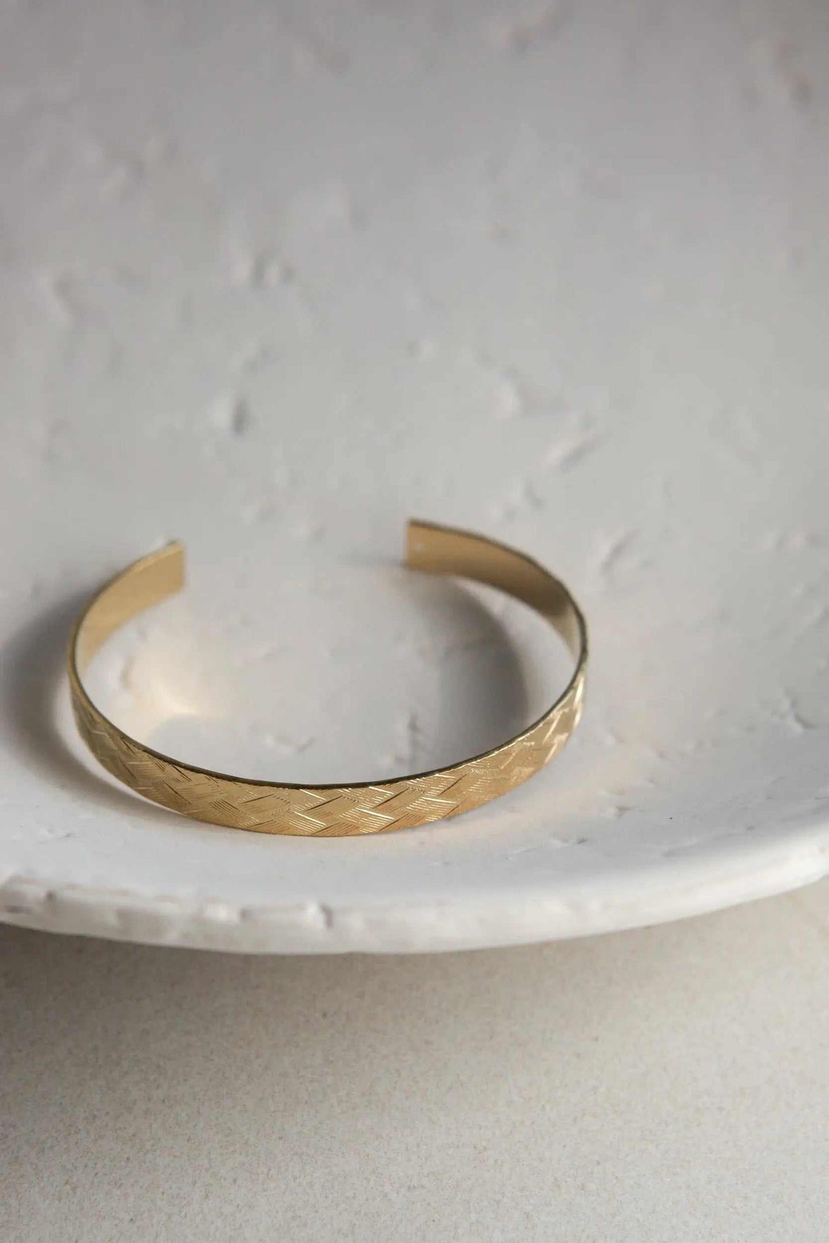 Gold elegant Cuff Bracelet with a textured straw-pattern surface, polished finish, and open adjustable cuff design