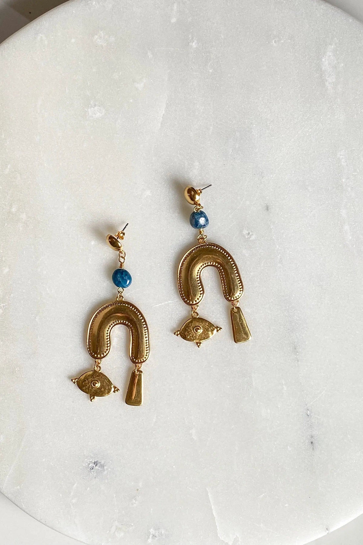 Gold Gypsy Earrings with blue beads and ornate gold-toned horseshoe charms, each finished with an eye charm and drop