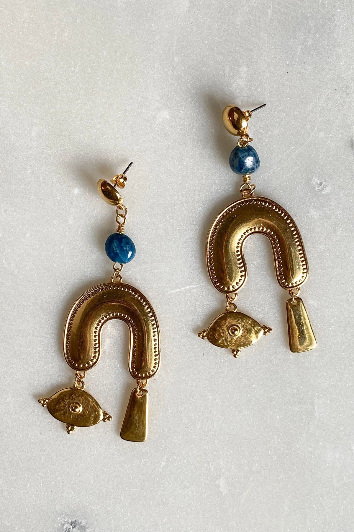 Gold Gypsy Earrings in gold-tone metal with blue round beads, horseshoe-shaped drops, eye charms and dangling bars