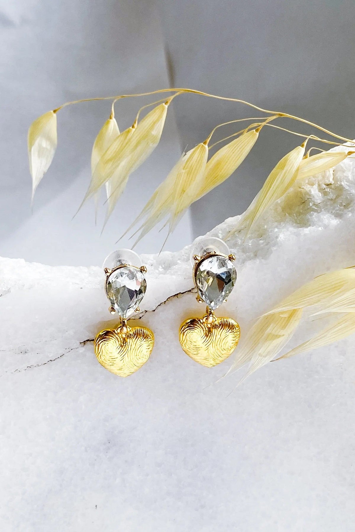 Gold Heart Earrings with sculpted gold-tone heart charms and clear teardrop crystals in silver-tone settings