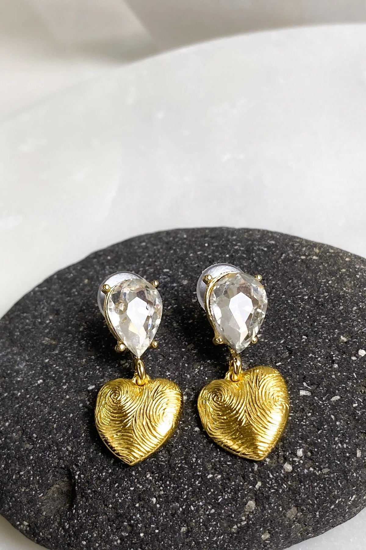 Gold Heart Earrings with textured gold heart drops and clear faceted teardrop crystals above each heart
