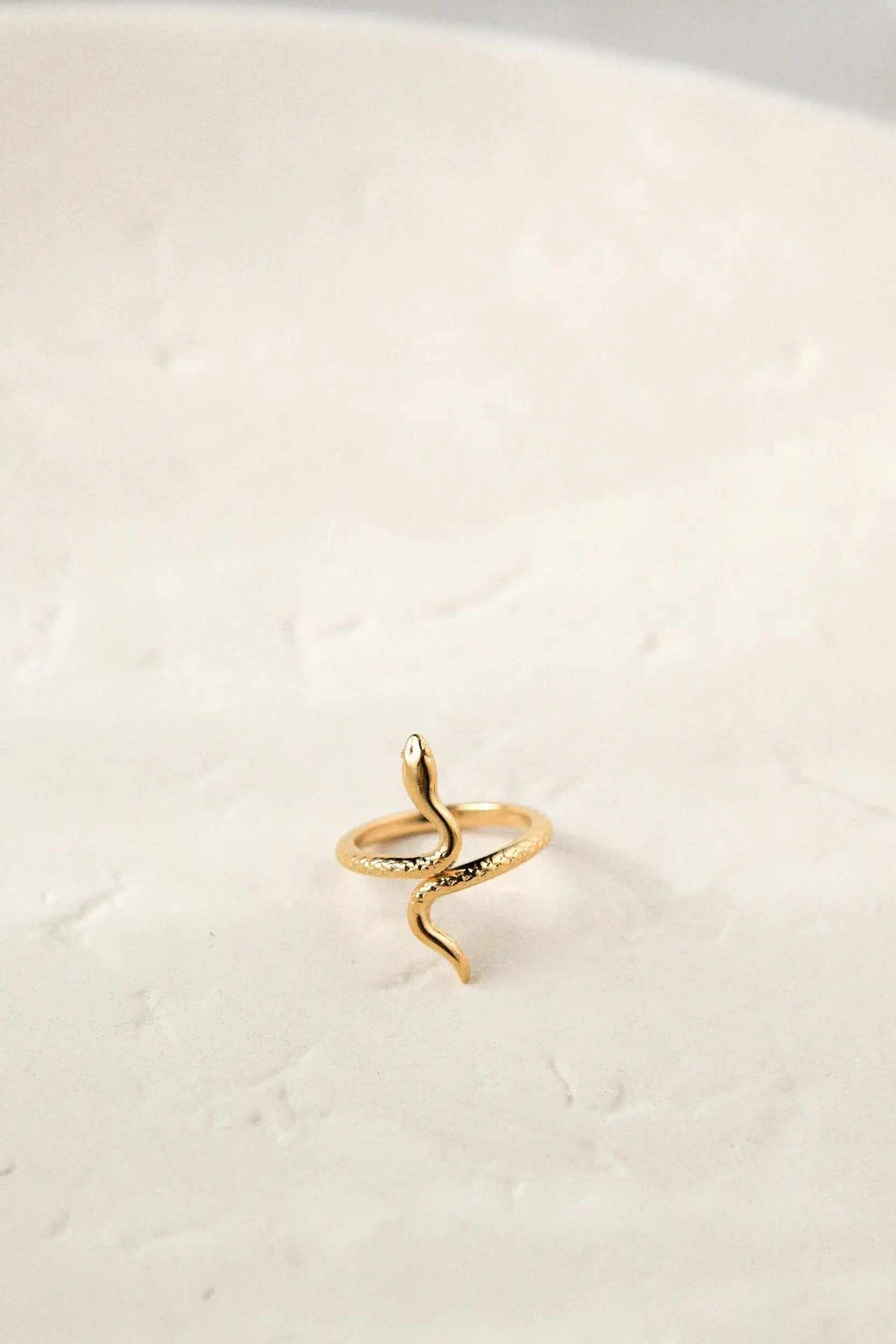 Gold Snake RING in polished gold-tone metal, shaped as a slender coiling serpent with a raised head