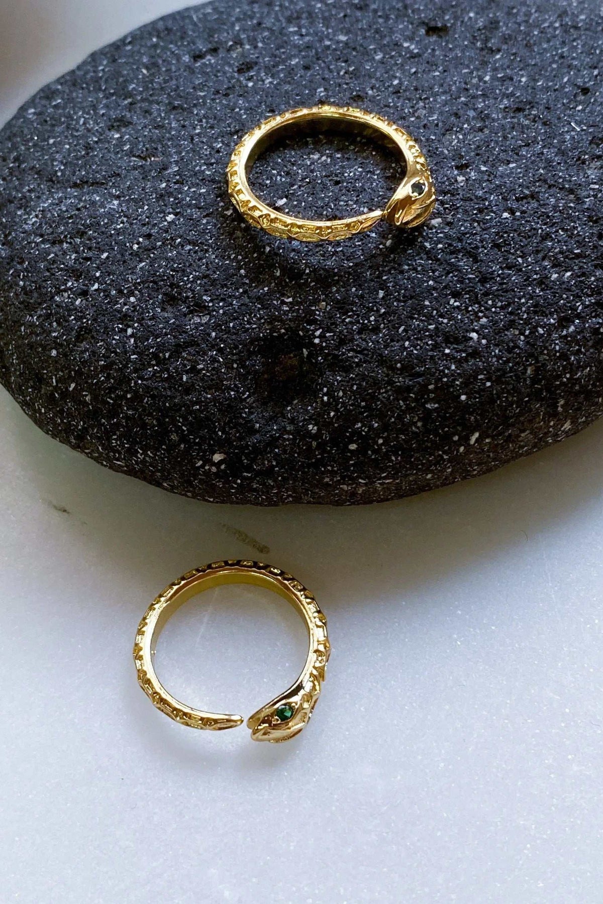 Gold Snake RING with a textured gold-tone serpent design and tiny green and clear stones at the snake head