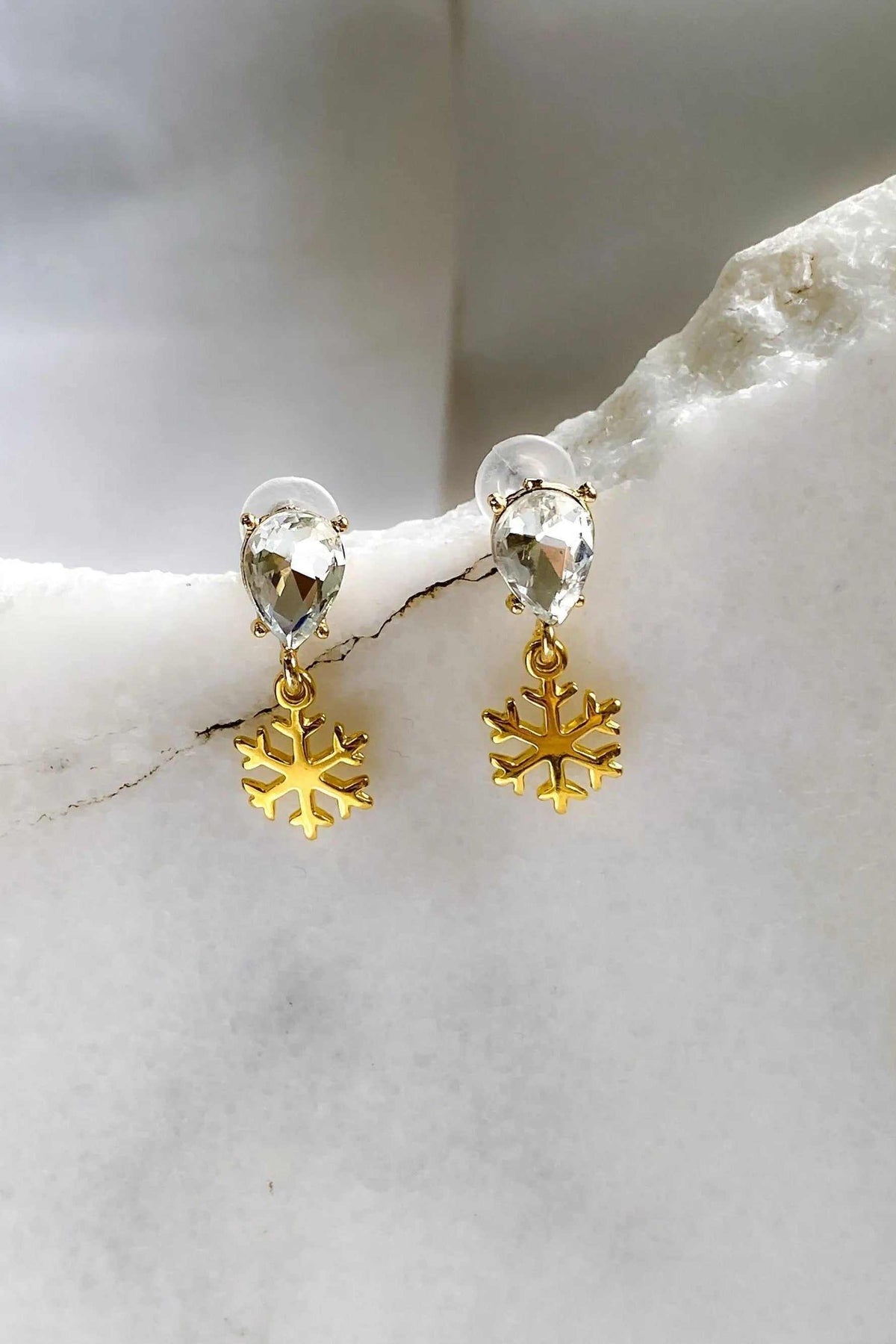 Gold Snowflake Earrings with gold-tone snowflake charms and clear faceted teardrop crystals on gold hooks