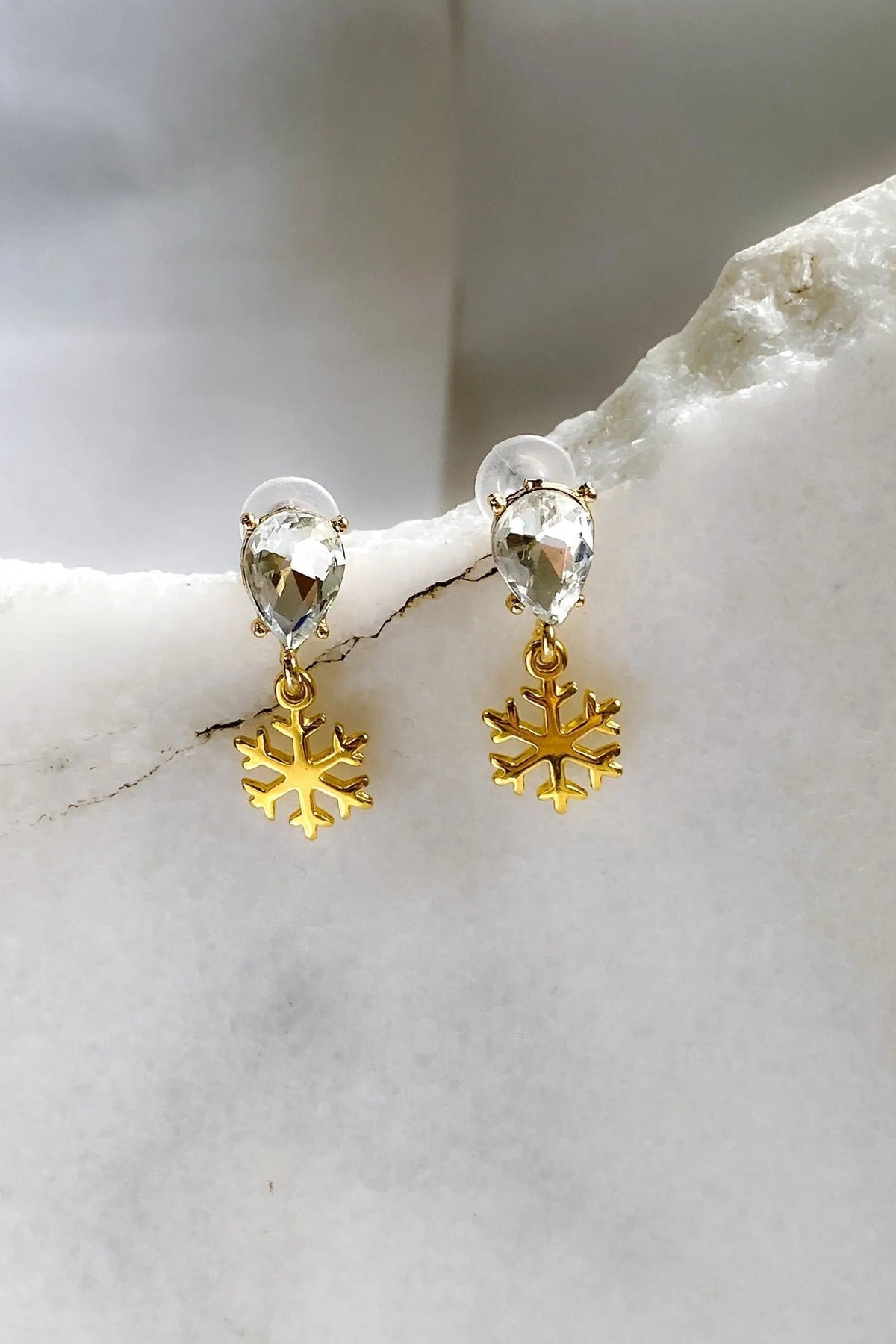 Gold Snowflake Earrings with gold-tone snowflake charms and clear teardrop crystals on stud posts