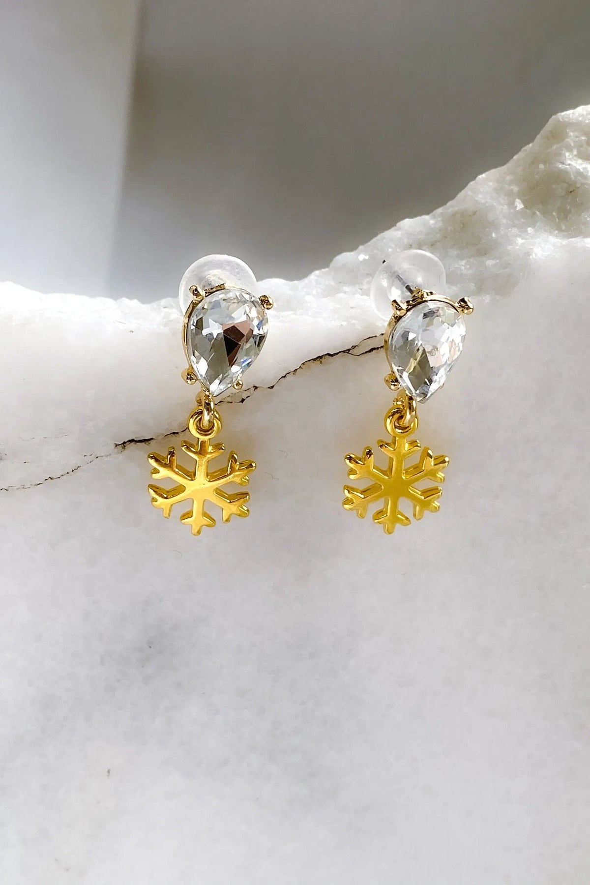 Gold Snowflake Earrings with gold-tone snowflake charms and clear teardrop crystals in sparkling settings