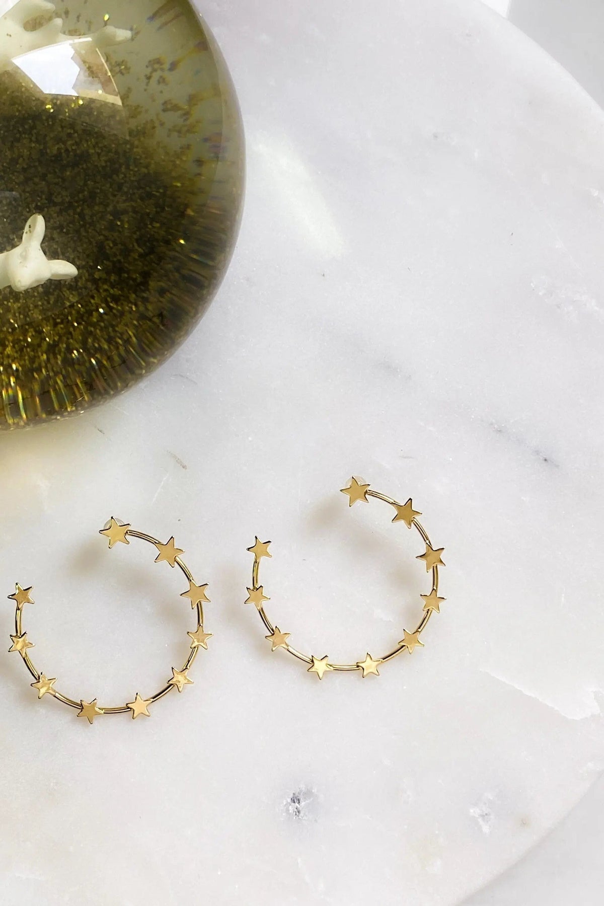 Gold Star Earring hoops in gold-tone metal, each outlined with small star charms for a celestial look