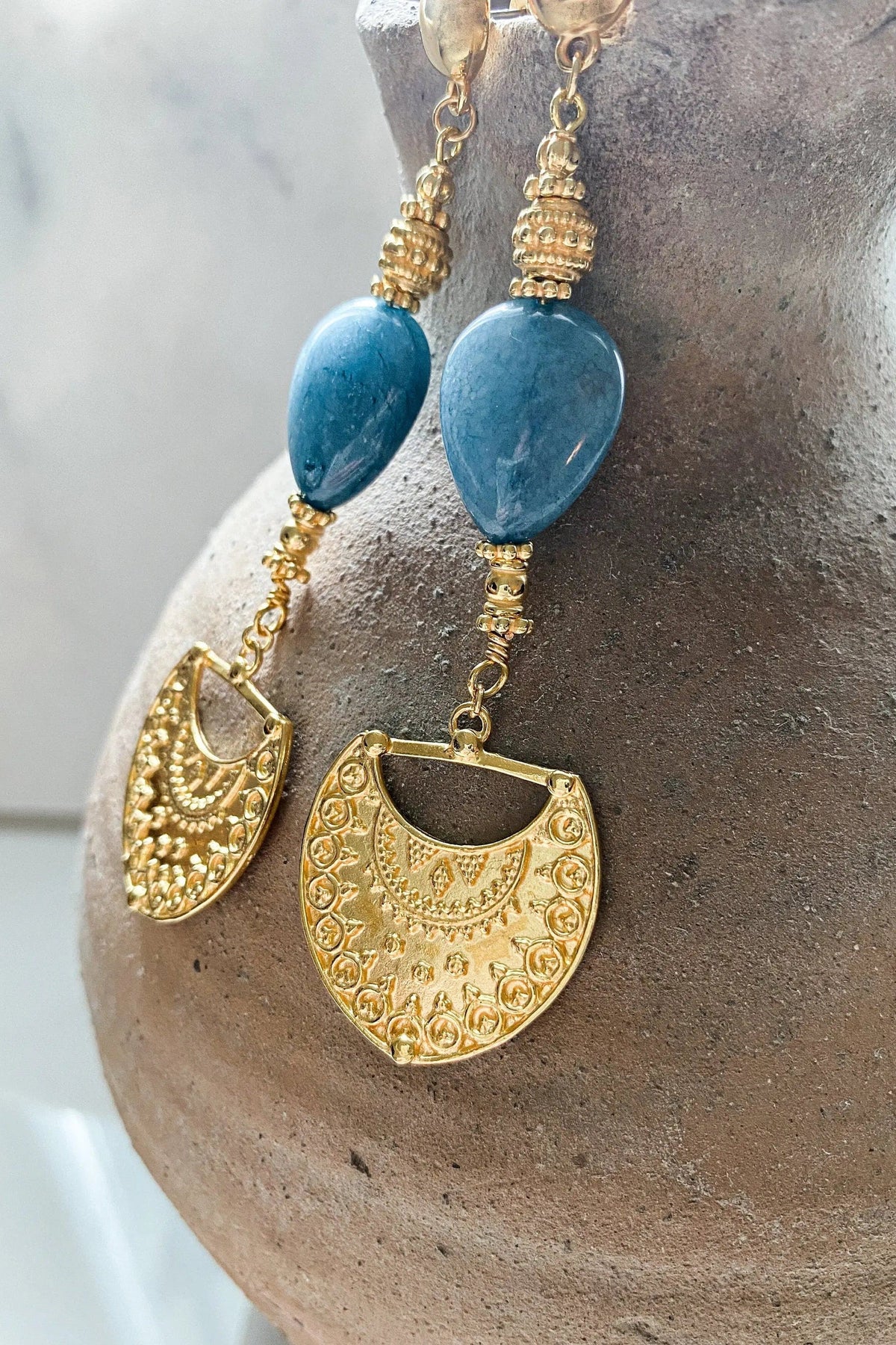 Gold Statement Dangle Earrings with blue teardrop stones, ornate gold-tone metalwork and crescent-shaped pendants