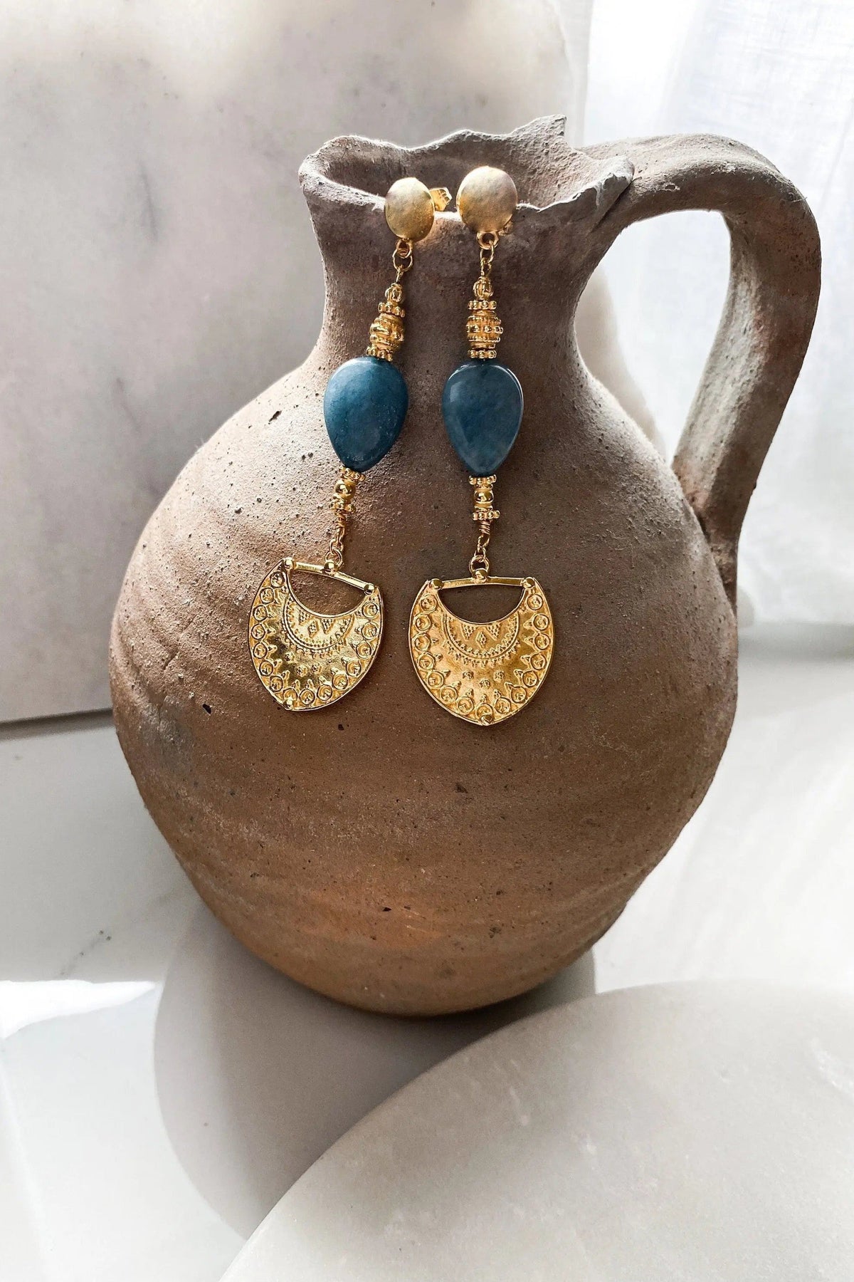 Gold Statement Dangle Earrings with blue teardrop stones and ornate gold-toned crescent-shaped charms