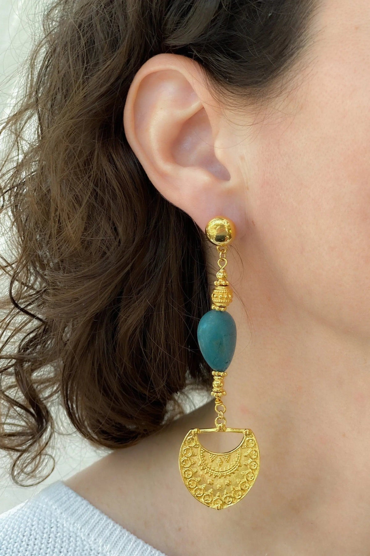 Gold Statement Dangle Earrings with ornate gold-toned brass details, a turquoise blue stone and engraved fan-shaped drop