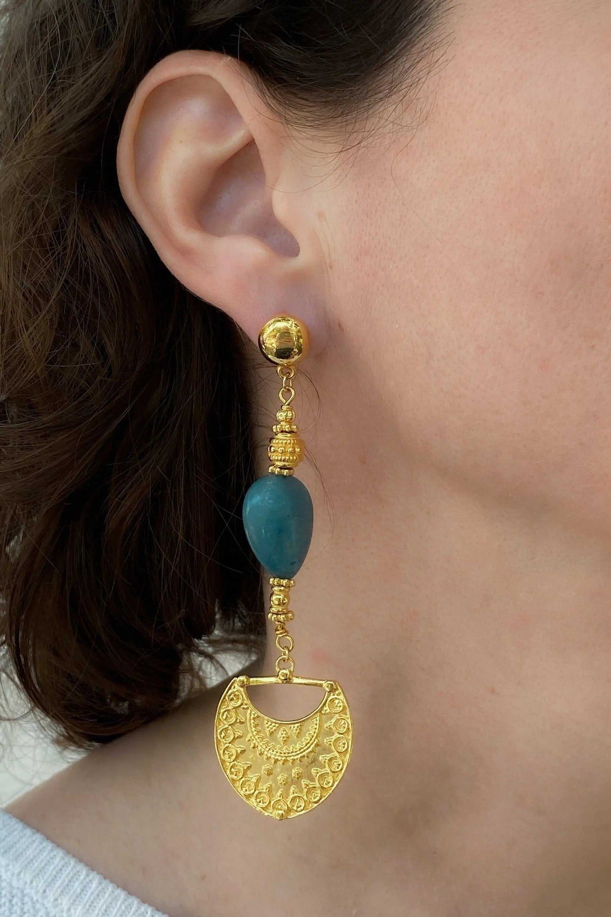Gold Statement Dangle Earrings with ornate gold-tone metalwork, a turquoise blue stone and a decorative fan-shaped drop