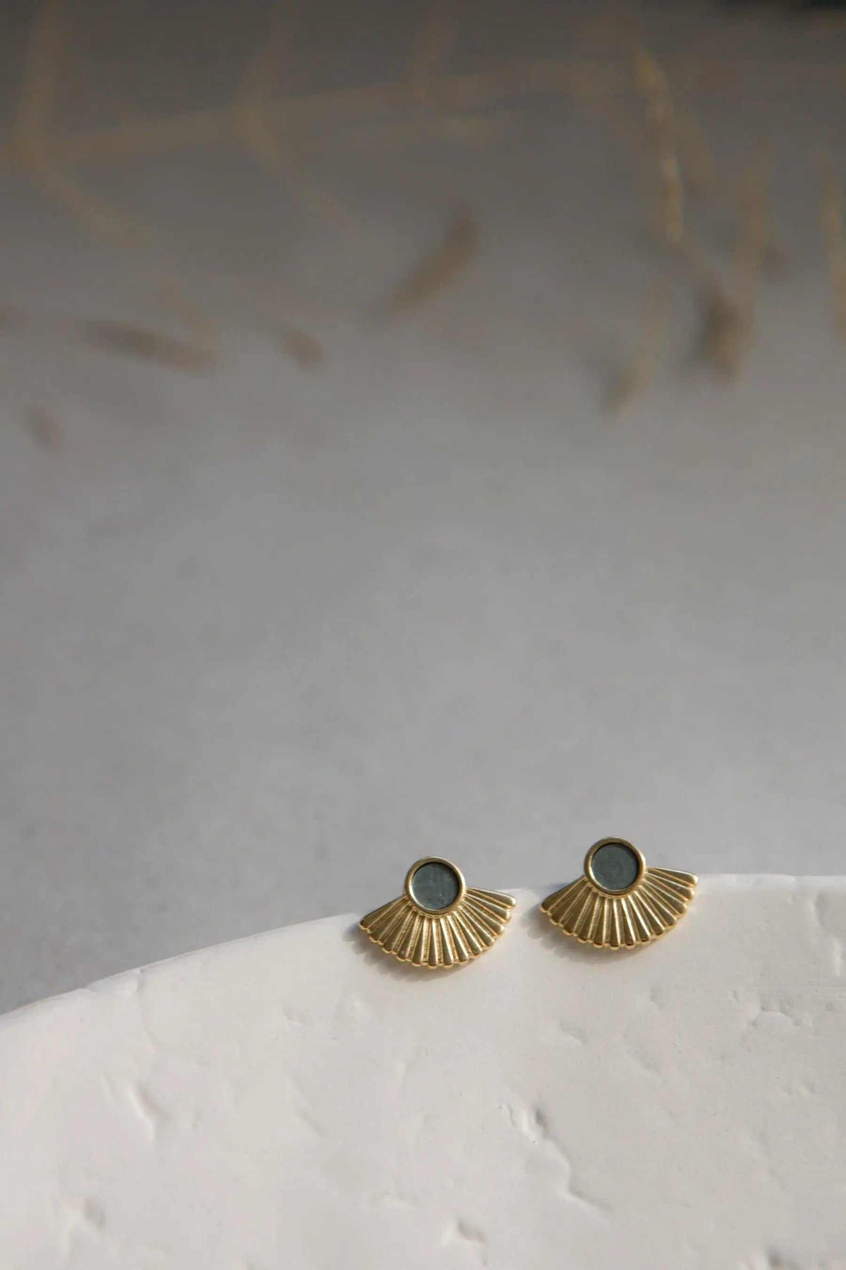 Gold Stud Earrings with fan-shaped sunburst design and dark resin centers, crafted in gold-tone metal