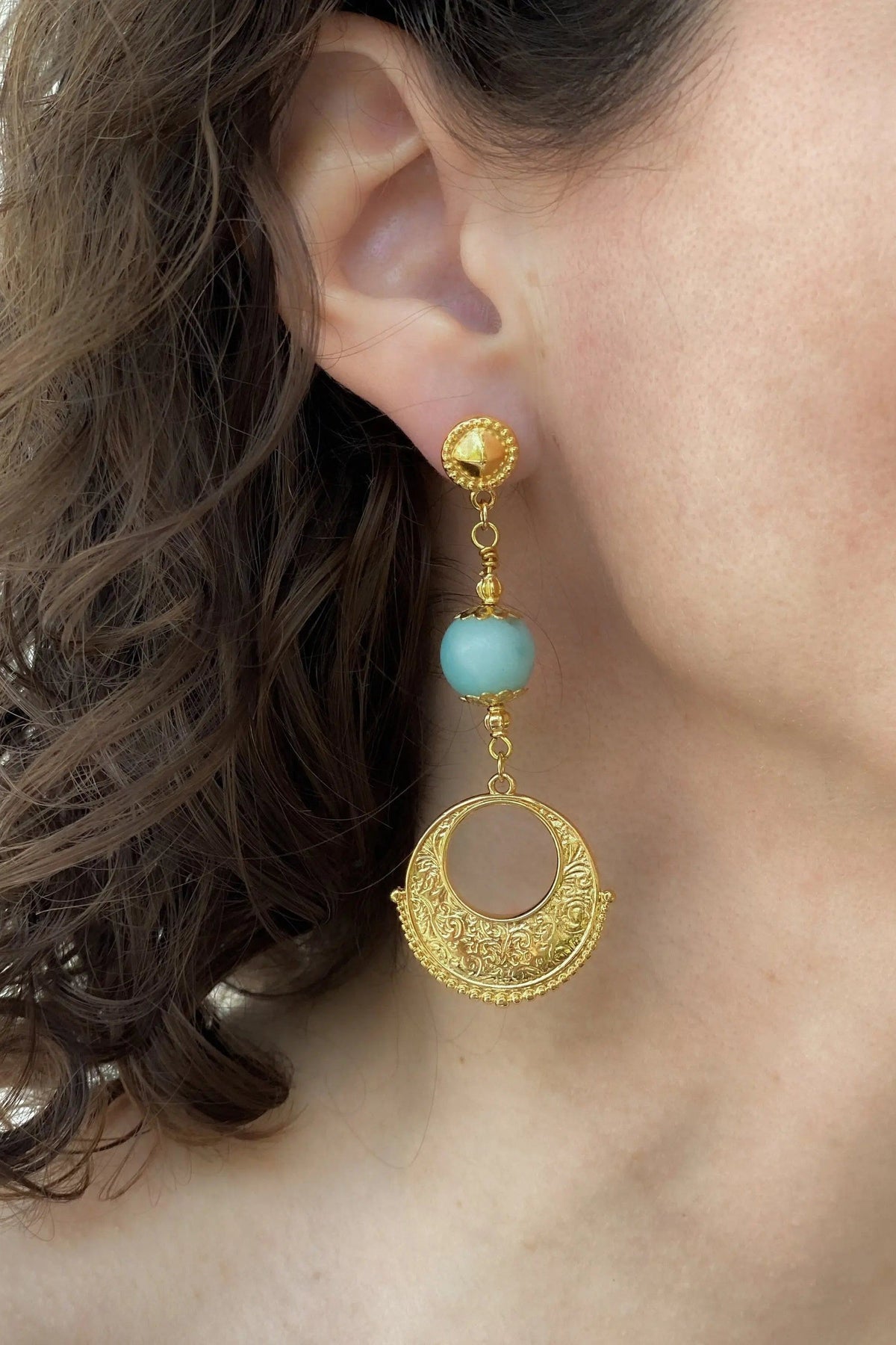 Gypsy gold Earrings feature ornate gold-tone filigree discs, turquoise beads and round stud tops in a dangling design