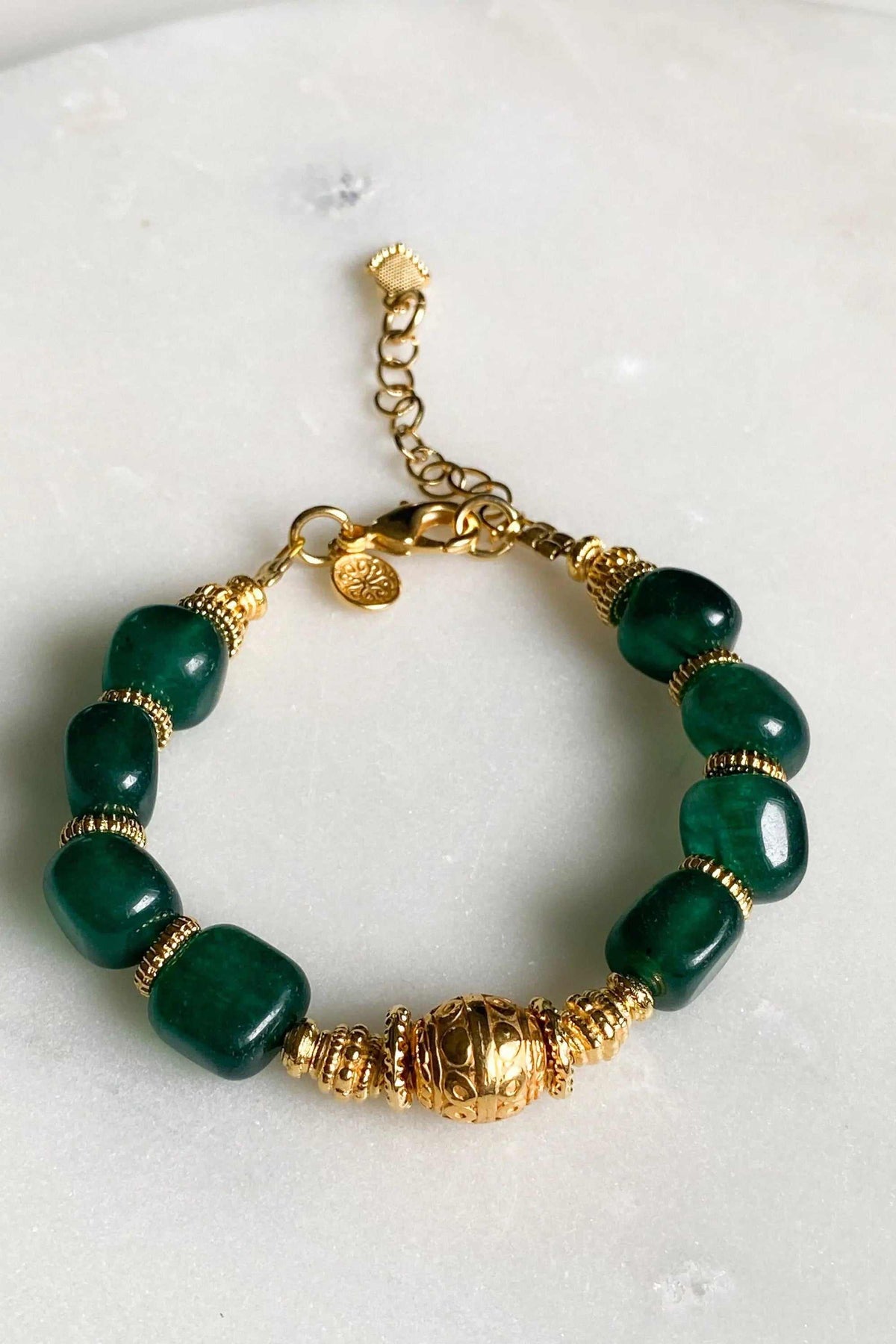 Healing Crystal Bracelet with polished dark green jade beads, gold-tone spacers, ornate central bead and extender chain