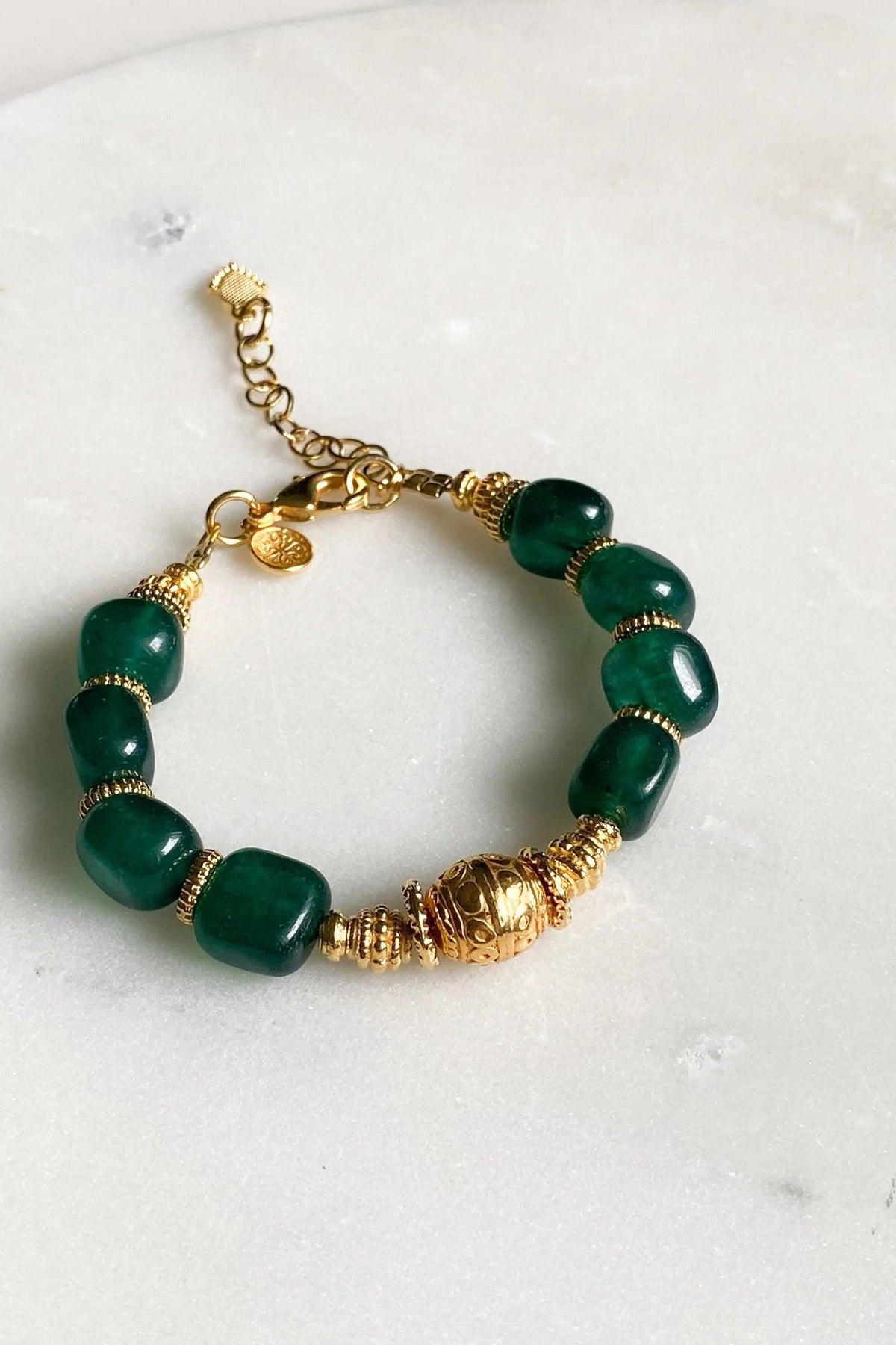 Healing Crystal Bracelet with deep green jade beads, gold plated accents and an ornate gold centerpiece with extender chain