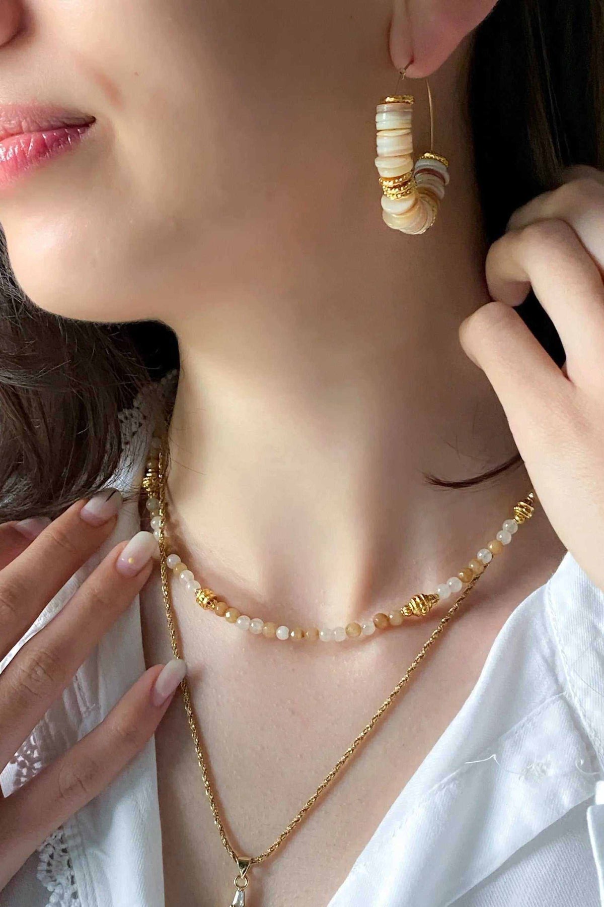 Heishi Bead Necklace with brown and cream agate beads, gold-tone details, and a delicate layered design