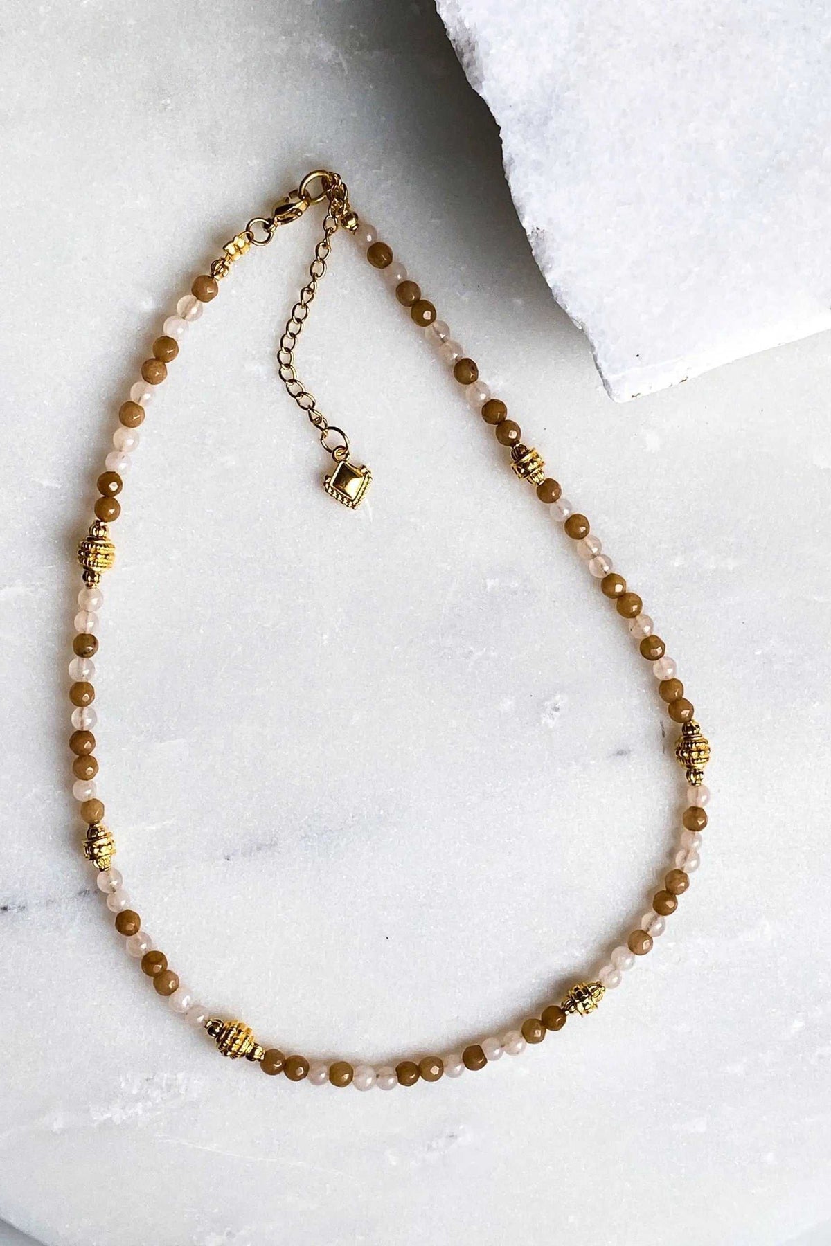 Heishi Bead Necklace with small round brown and cream beads, gold-tone spacer details, and an extender chain