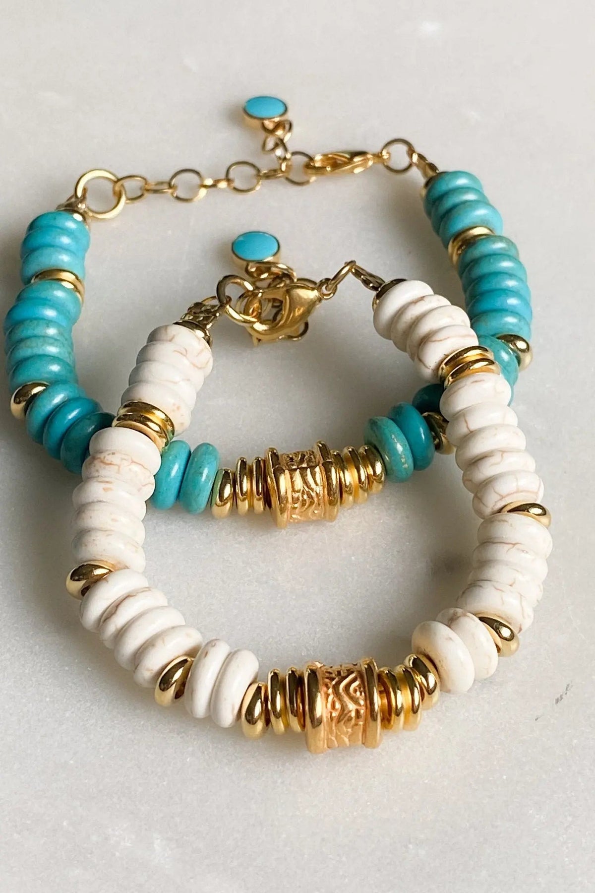 Heishi howlite beads bracelet with white and turquoise disc beads, gold-tone spacers and ornate central details