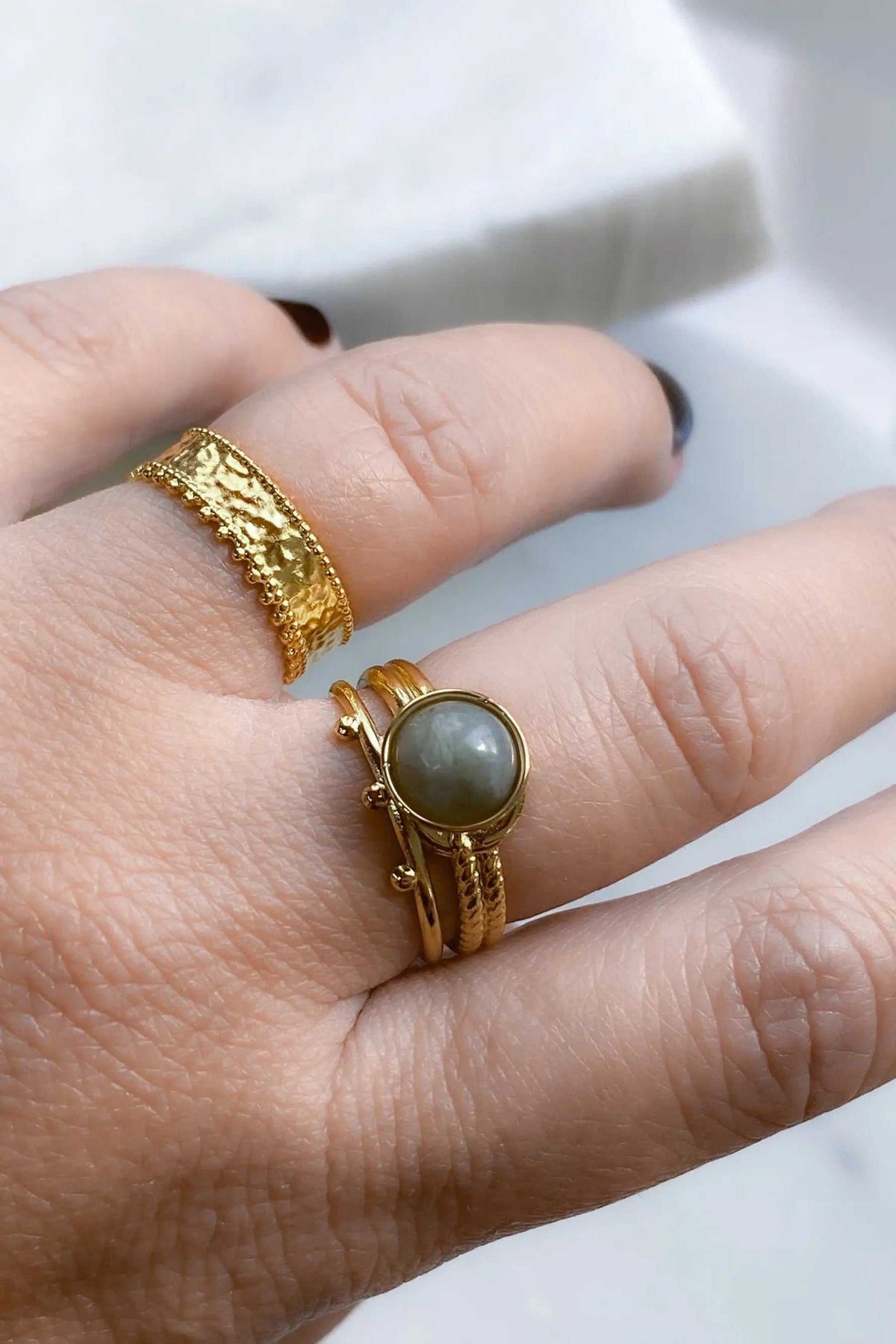 HERMINA Gold Stone Ring with a round grey labradorite stone in a textured gold setting and layered band