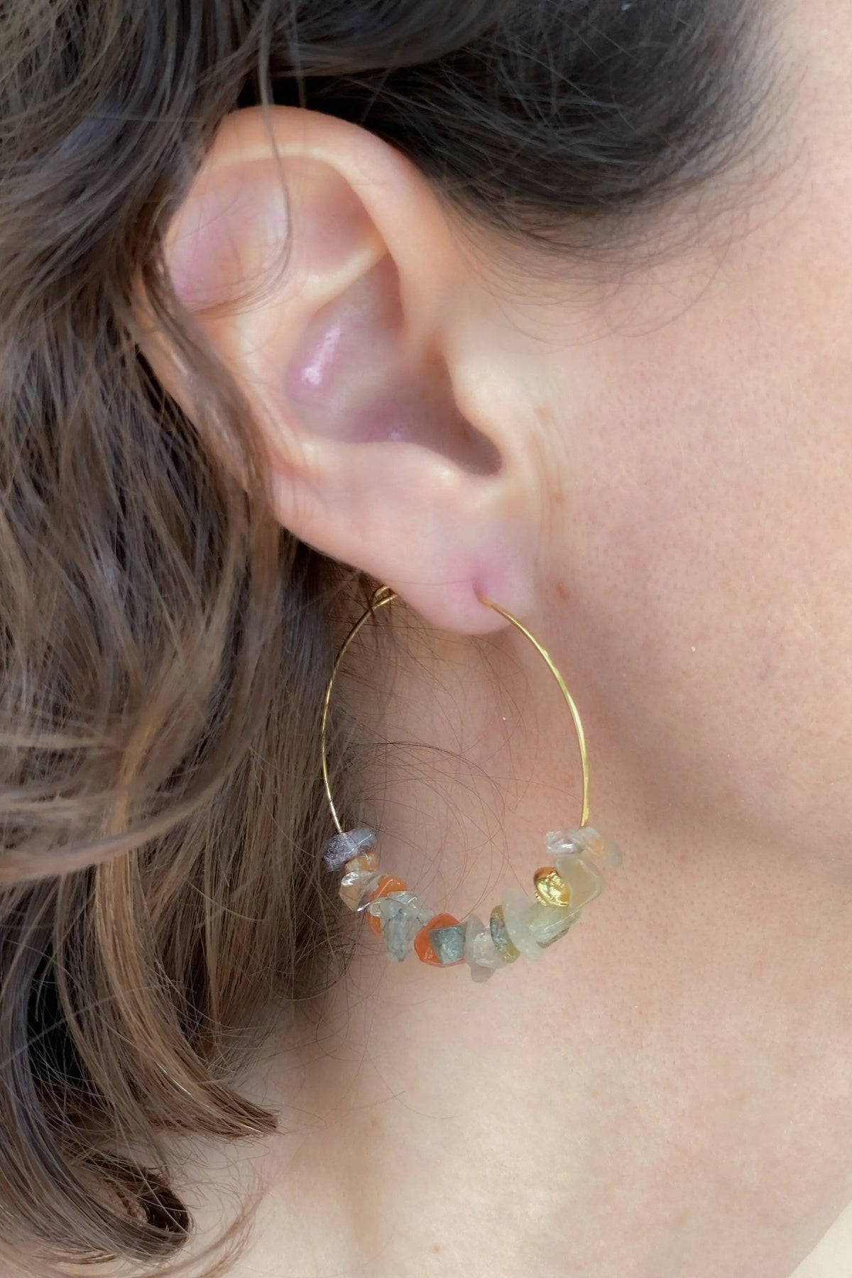 Hoop crystal earrings in a thin gold-tone wire hoop, accented with irregular translucent multicoloured gemstone chips