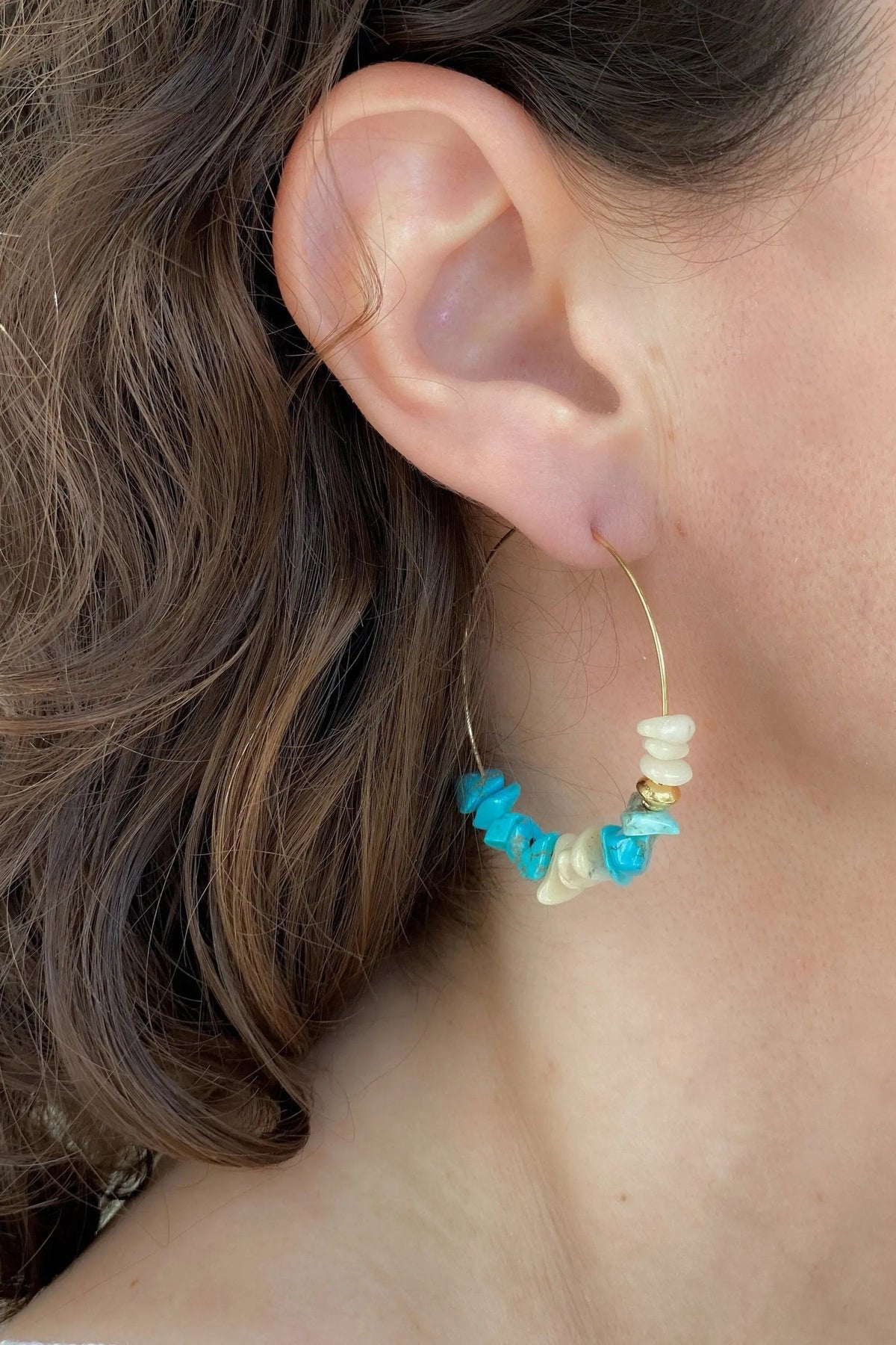 Hoop crystal earrings with a delicate gold-tone wire hoop and bright turquoise chips mixed with creamy white stones