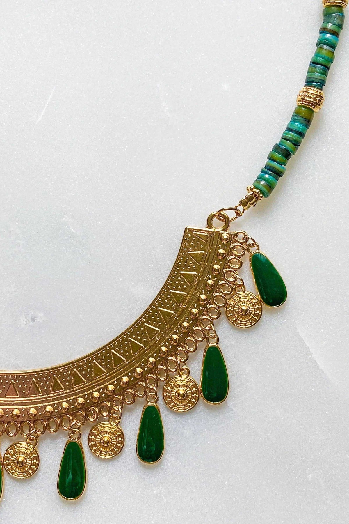 ILIADA NECKLACE with a gold-tone ornate pendant, deep green enamel teardrops and turquoise-green beaded strand