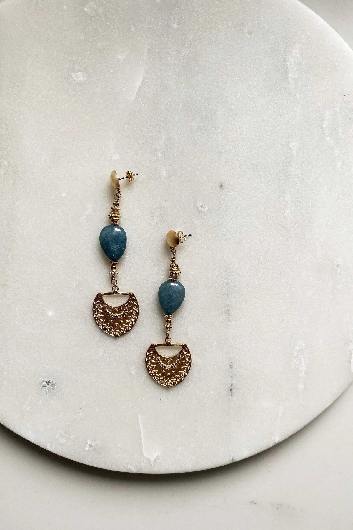 INÓ EARRINGS with blue oval stones, gold-tone coiled details and ornate crescent-shaped drops with dotted patterns