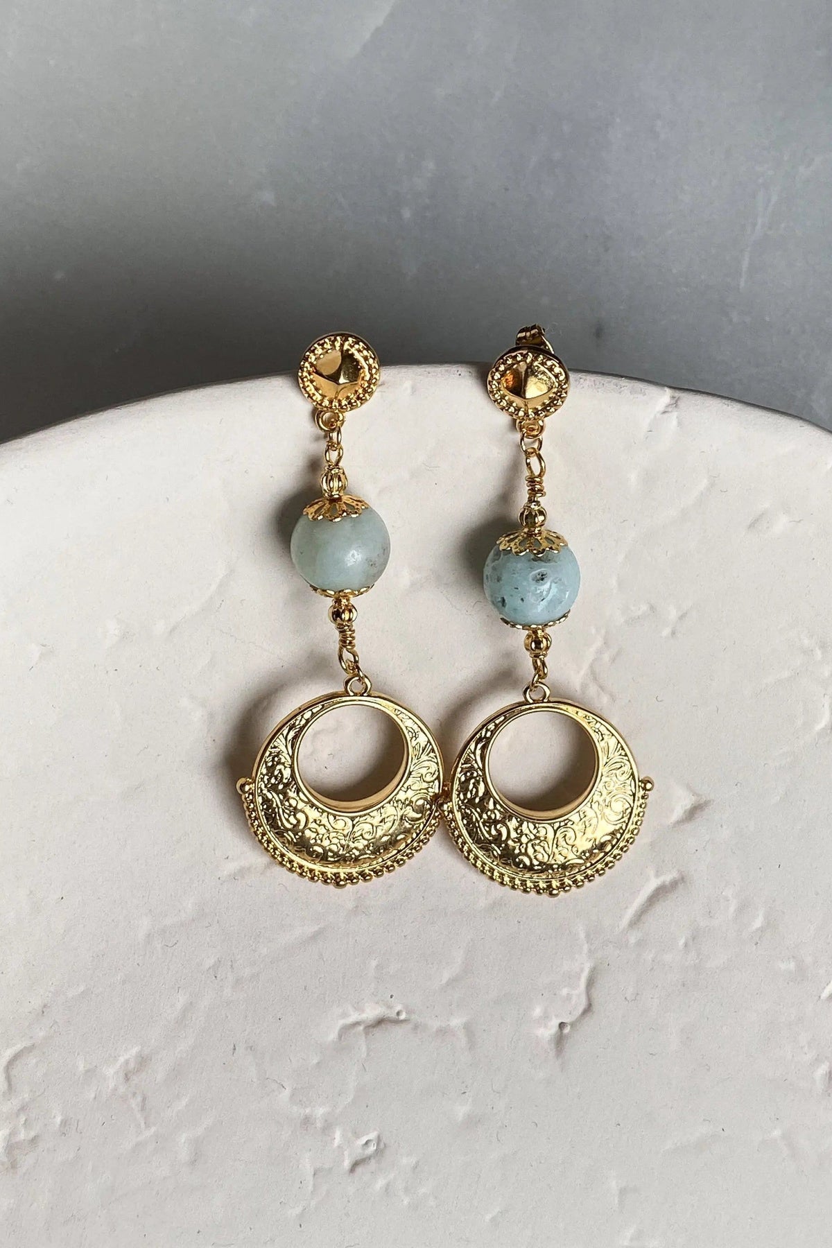 IRIS Amazonite Earrings with pale blue-green stone beads and ornate gold-tone circular drops in a dangling design