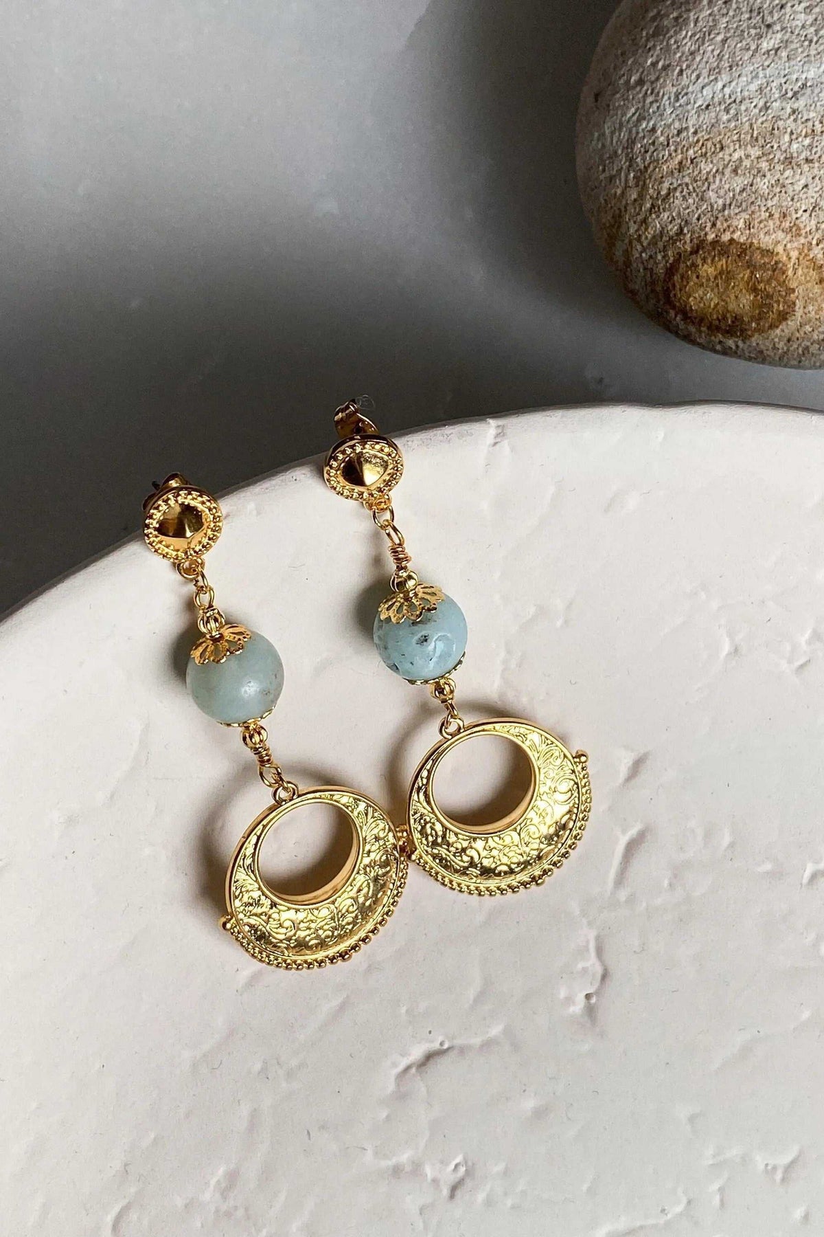 IRIS Amazonite Earrings with pale blue-green stone beads, ornate gold-tone circular drops and textured sunburst detailing