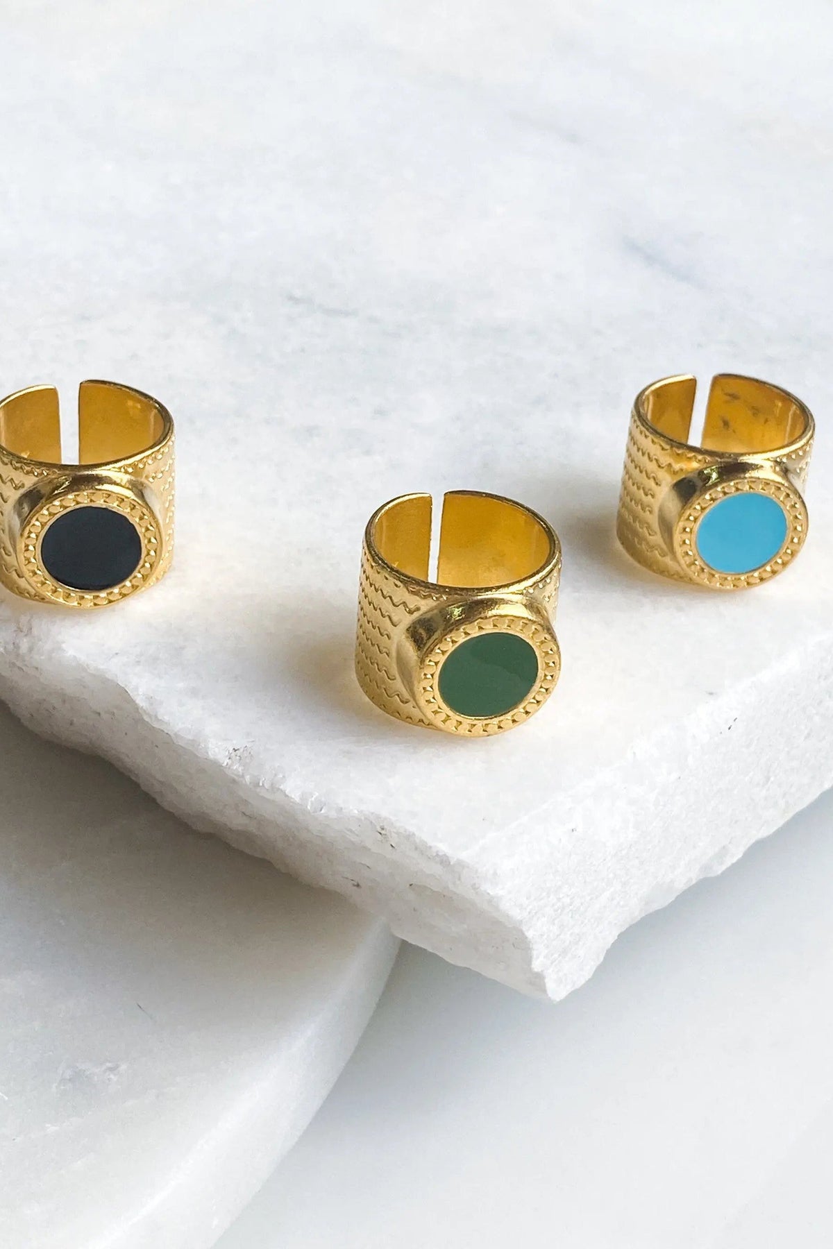 KARMI Gold wide band ring in textured gold with black, green and turquoise resin insets framed by beaded edges