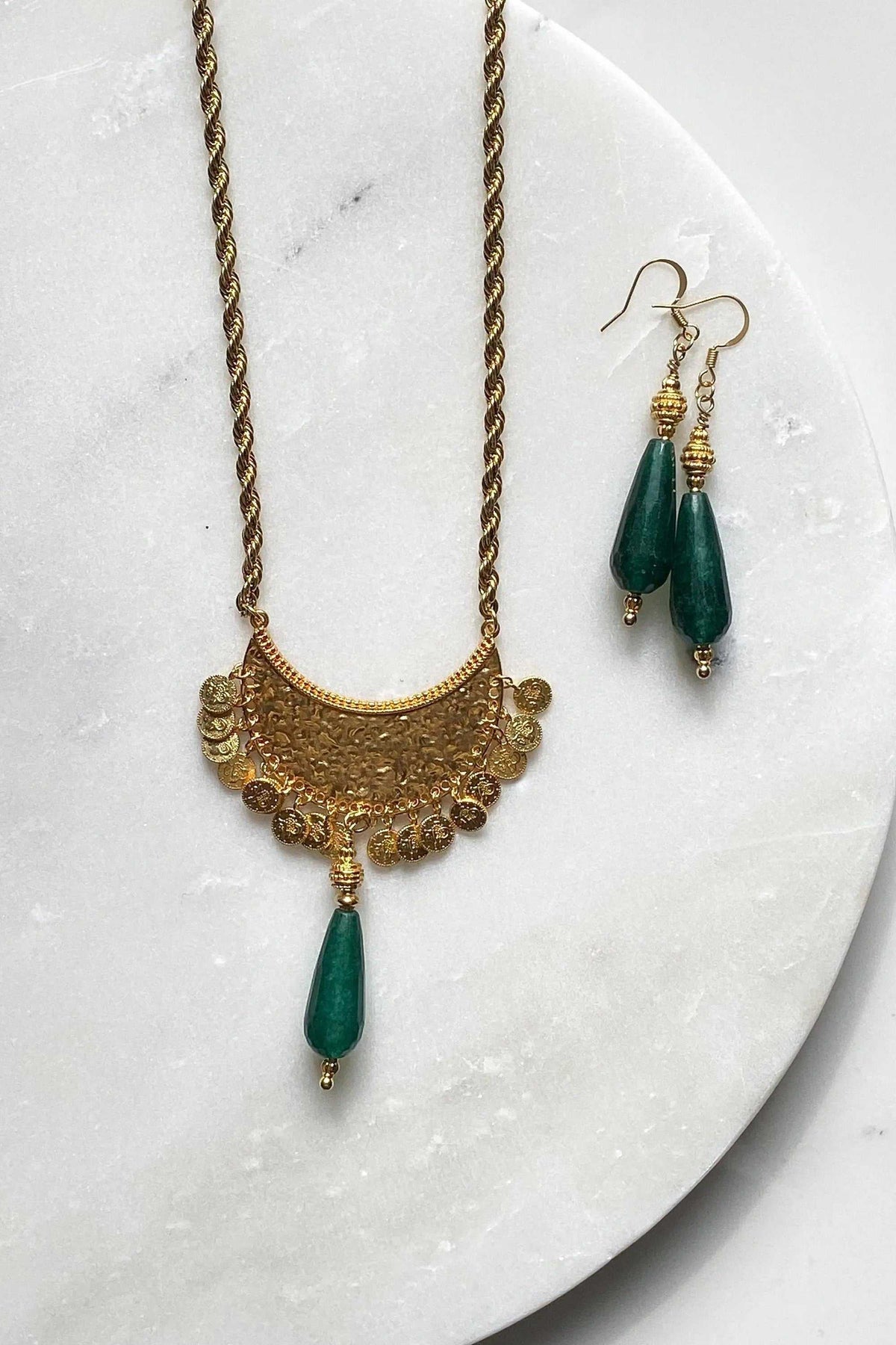 KIVÉLI Boho Necklace, long gold-toned chain with ornate pendant and green teardrop gemstone, matching earrings