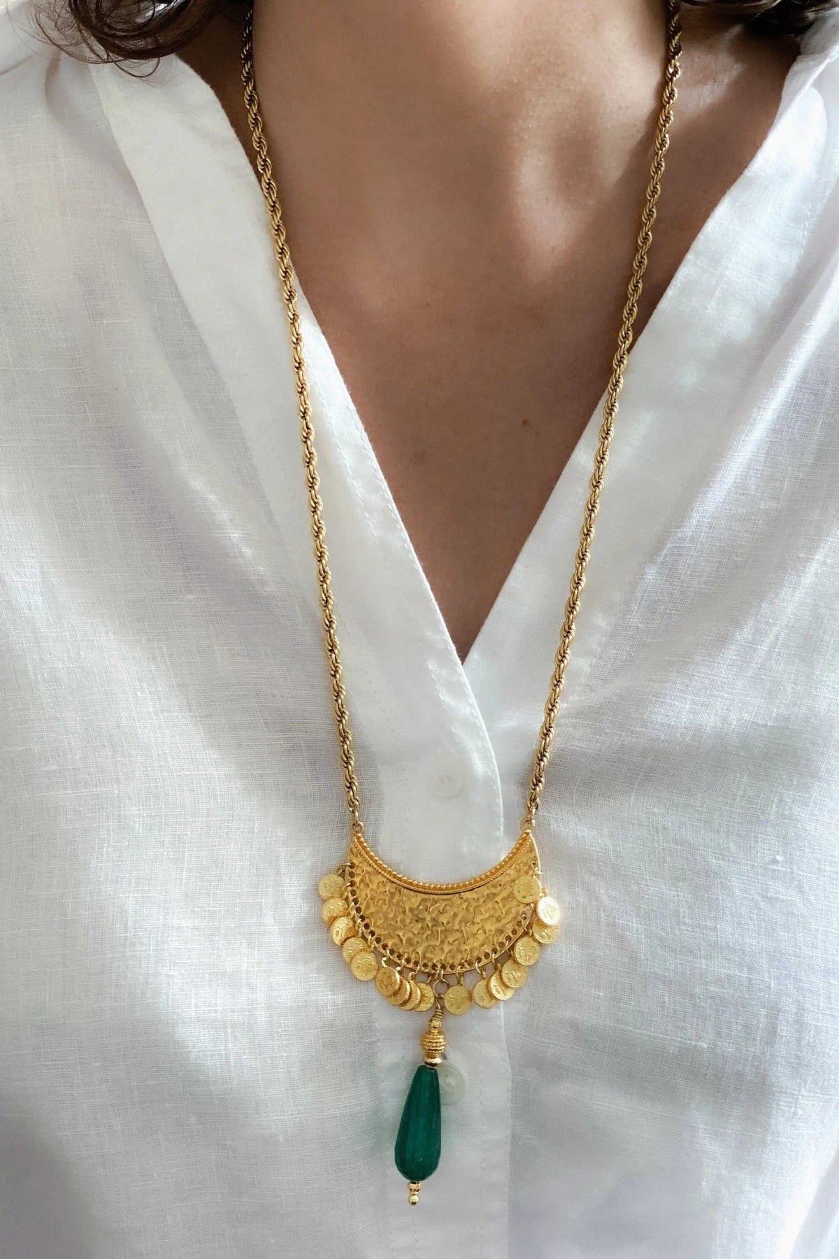 KIVÉLI Boho Necklace in gold-toned metal with ornate coin pendant and deep green jade teardrop