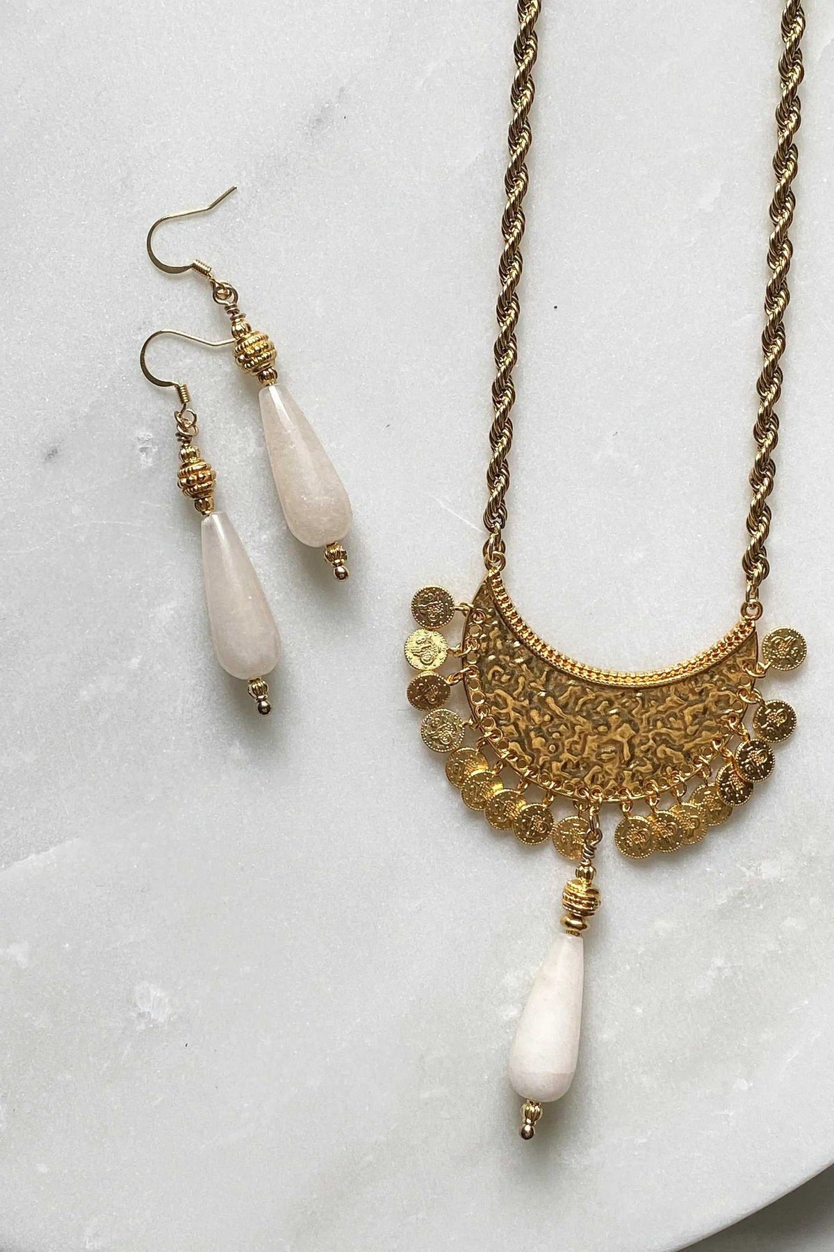KIVÉLI Boho Necklace with antique gold-tone filigree pendant and white teardrop stone, matching earrings