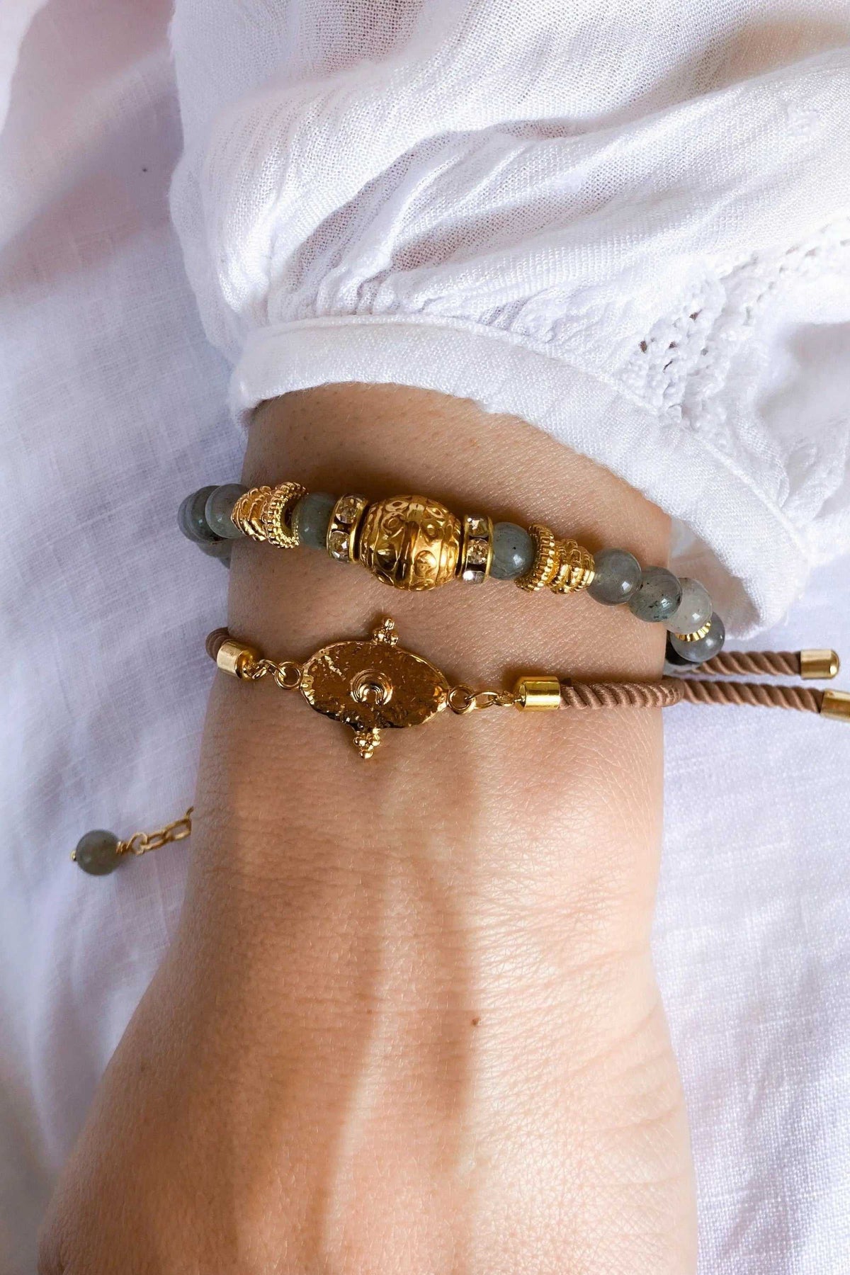 Labradorite beaded bracelet with grey-green round stones, ornate gold-tone beads and an adjustable sliding cord