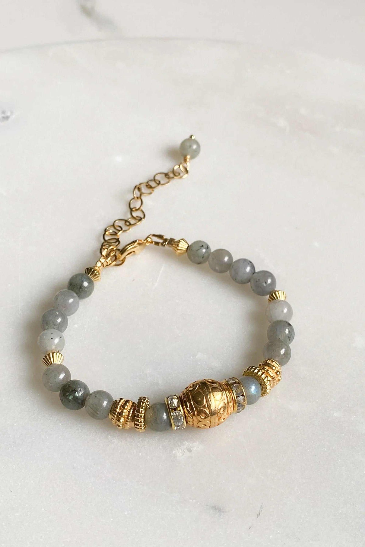 Labradorite beaded bracelet with grey round stone beads, ornate gold-tone accents and an adjustable chain