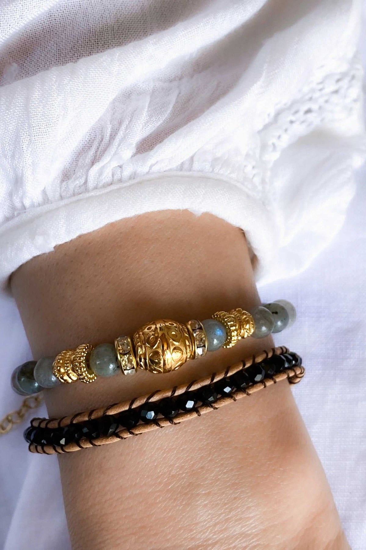 Labradorite beaded bracelet with grey-blue round stones, ornate gold-tone beads and an adjustable chain