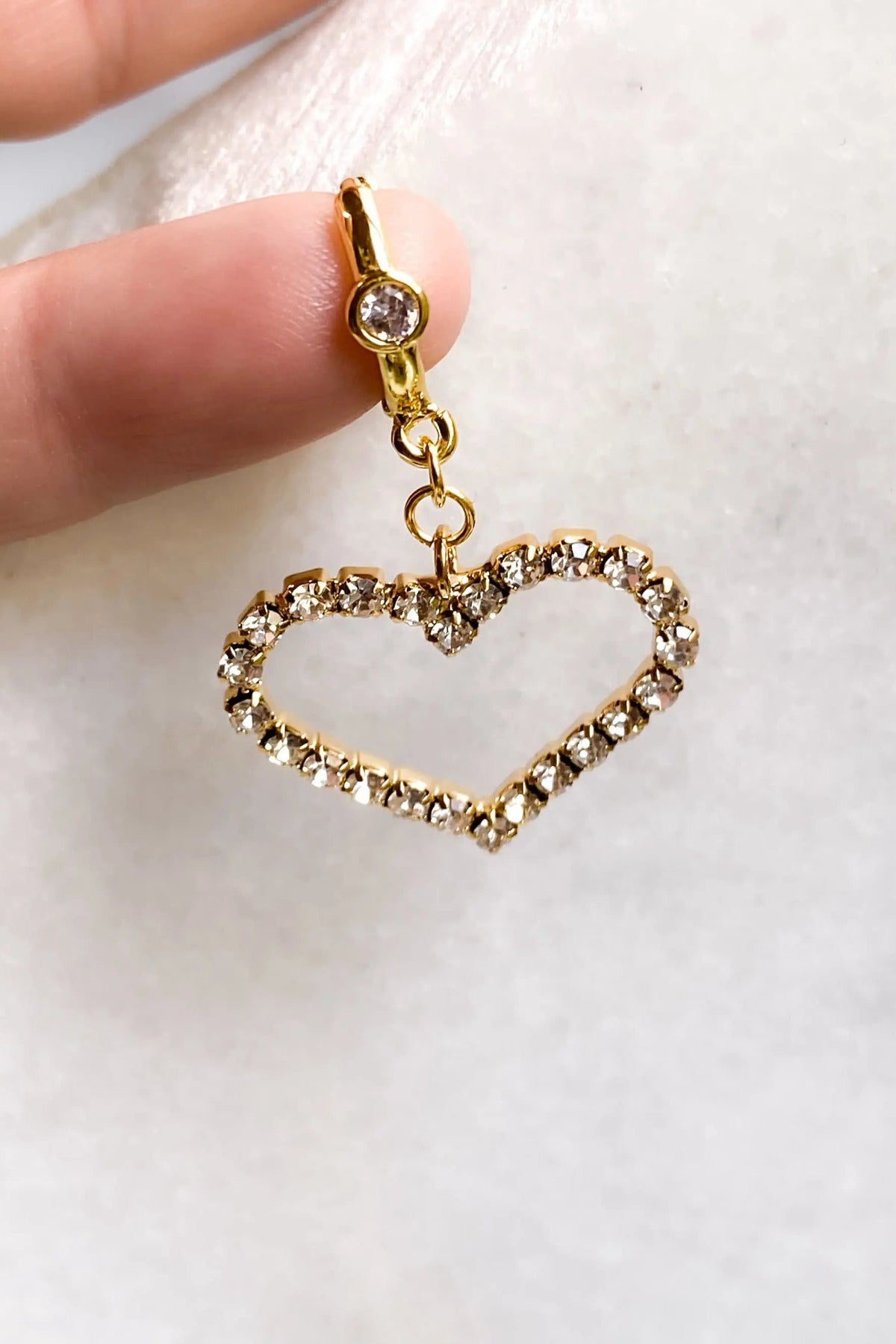 Large Heart Earrings with gold-tone huggie hoop, clear crystal accents and an open heart-shaped drop charm
