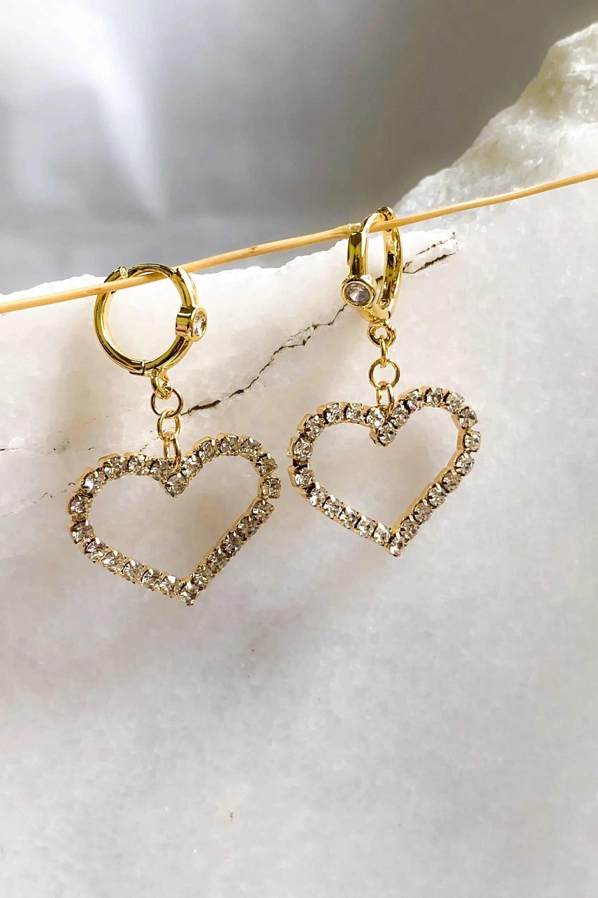 Large Heart Earrings with gold-tone huggie hoops and open heart charms outlined in sparkling clear crystals
