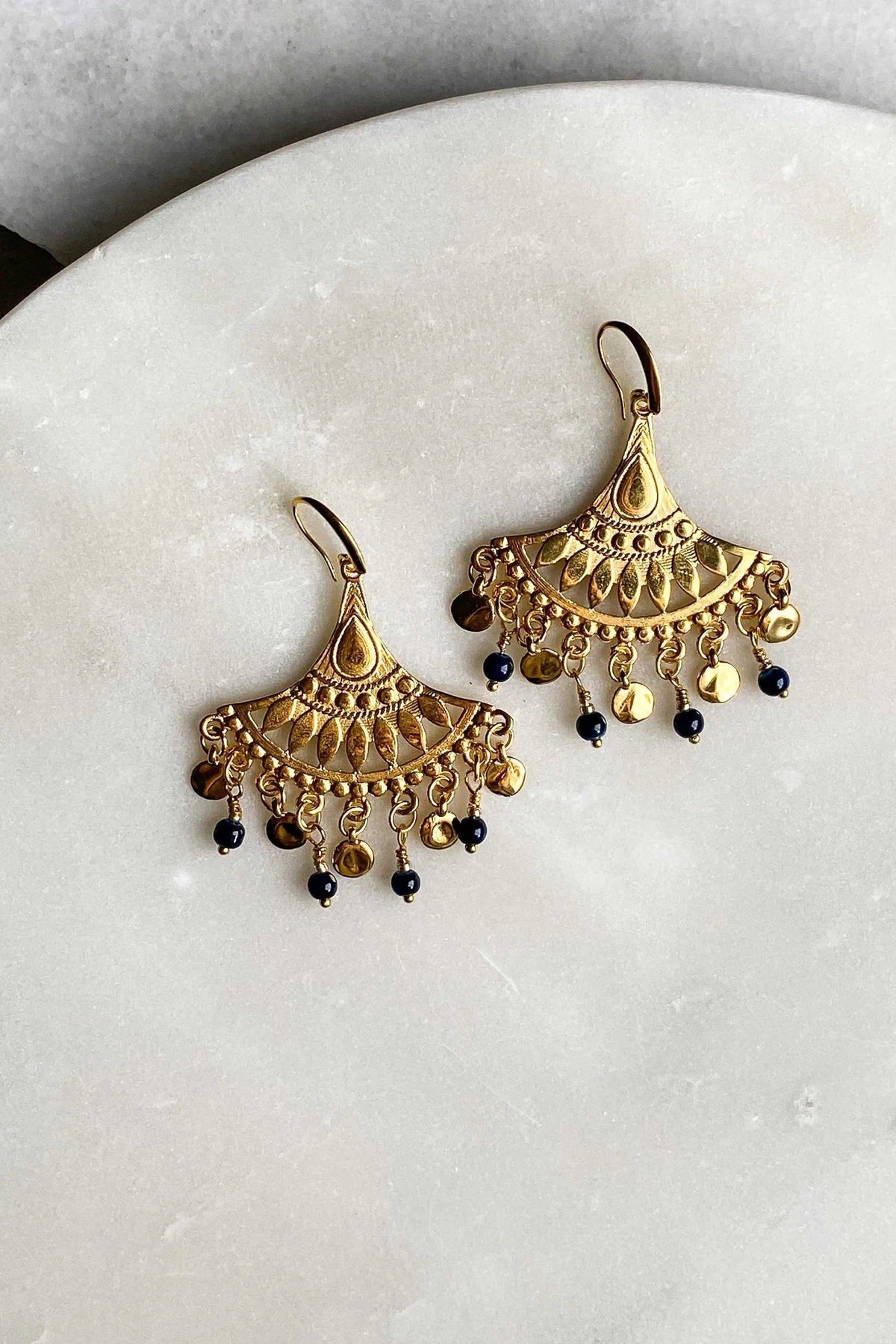 LITÓ EARRINGS in ornate gold-tone brass with intricate fan-shaped detailing and dangling black and amber beads