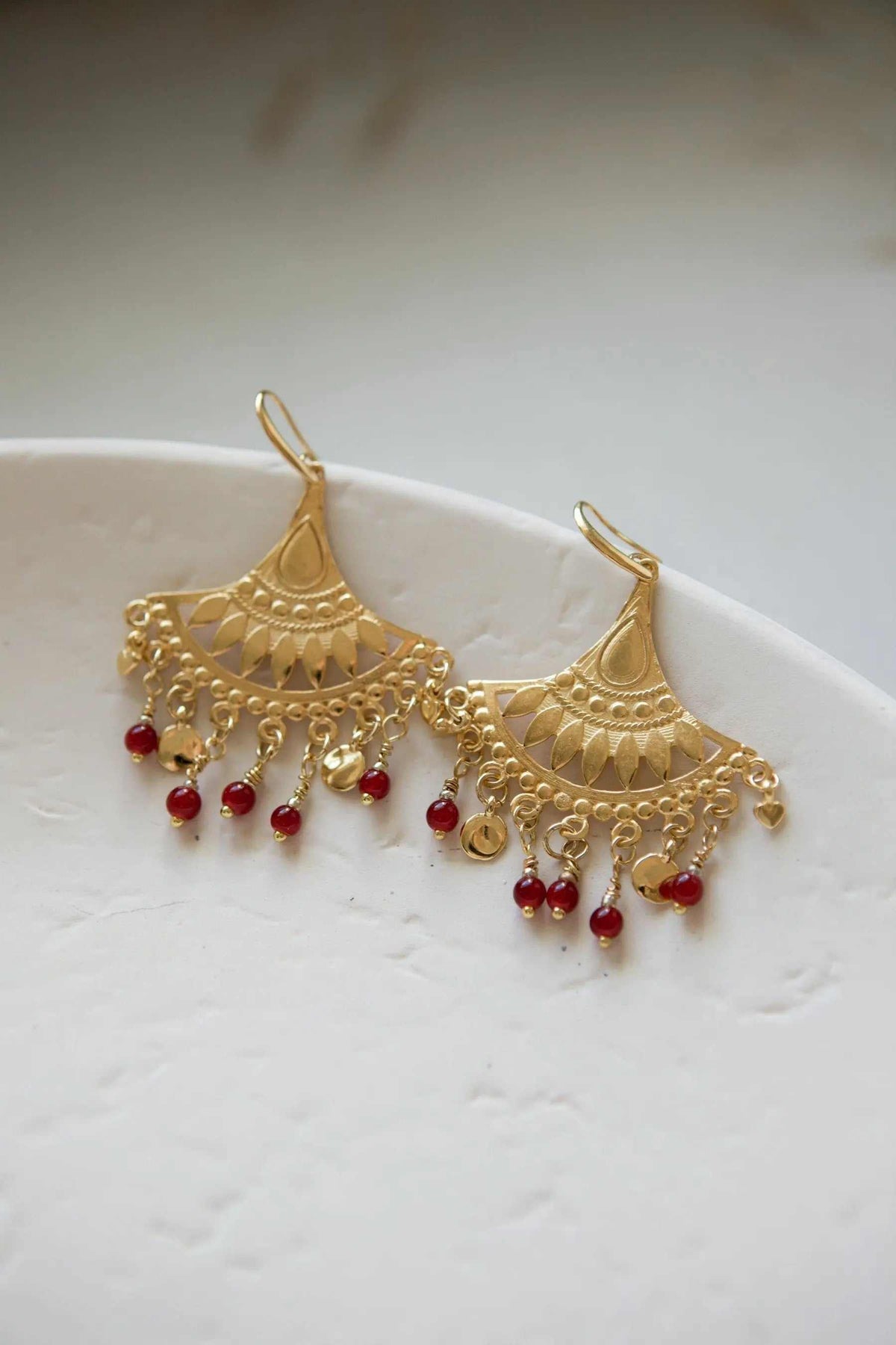 LITÓ EARRINGS, ornate gold-tone chandelier earrings with red and clear dangling beads and filigree detailing