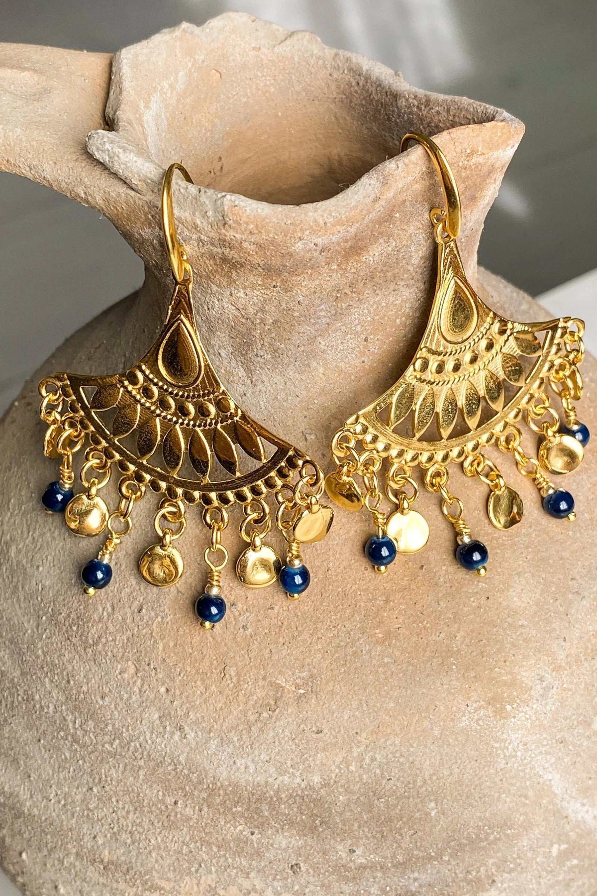 LITÓ EARRINGS are gold-tone statement earrings with ornate fan-shaped filigree and dangling blue and gold beads