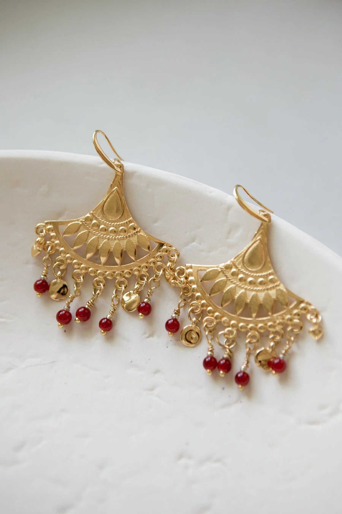 LITÓ EARRINGS gold-tone filigree chandelier earrings with red glass bead charms and ornate dangling details