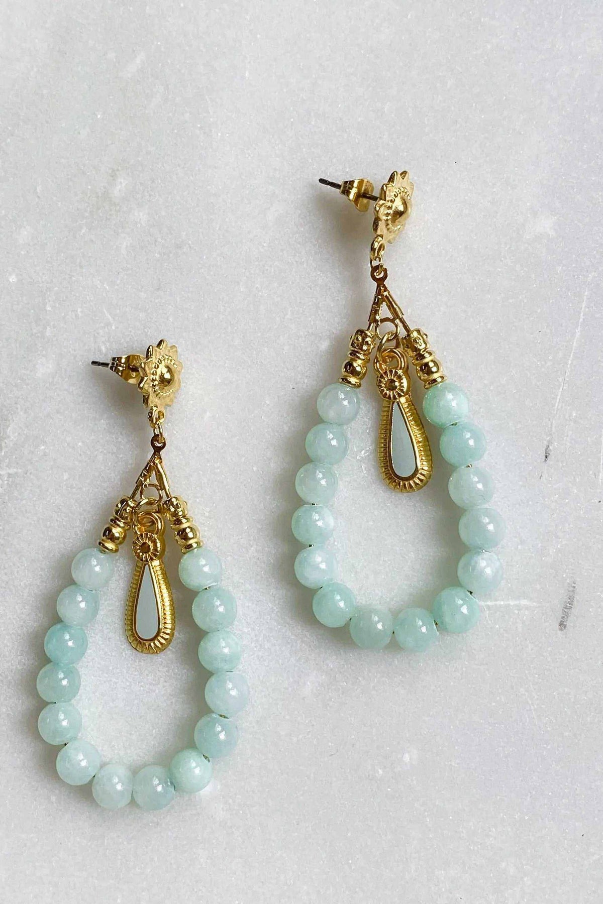 LUNO Oversize hoops earrings with pale green round beads, ornate gold-tone filigree and teardrop loop details