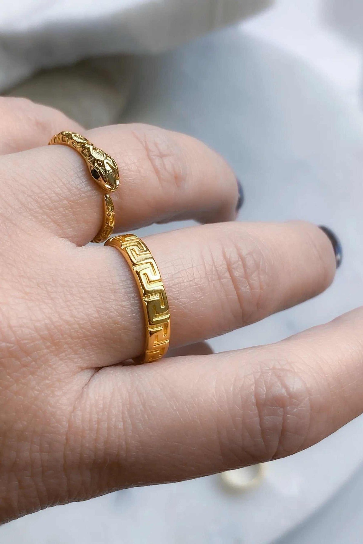 MEANDER Gold band Ring in shiny gold-tone metal with an engraved Greek key pattern and raised decorative detail