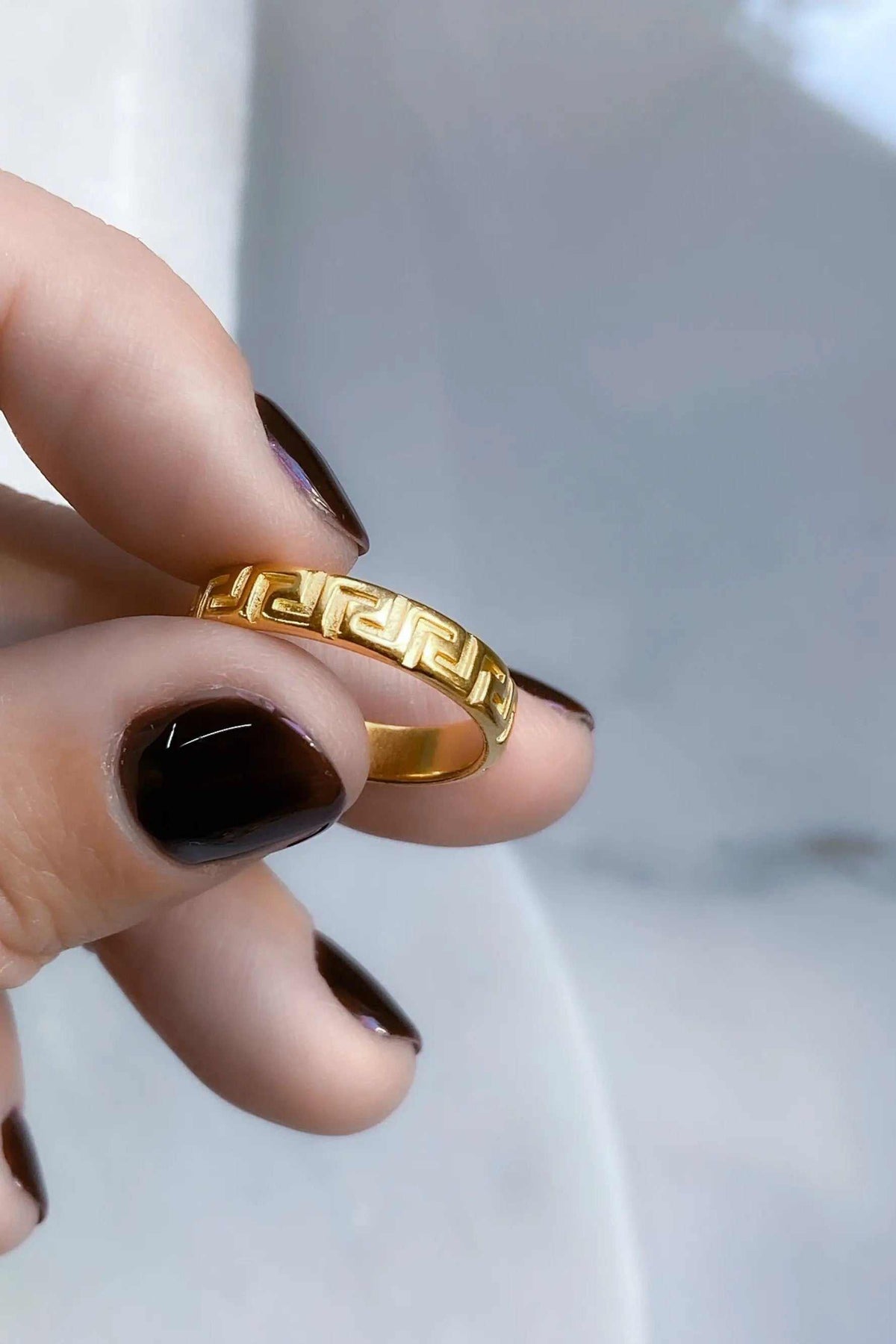 MEANDER Gold band Ring, polished gold-tone metal with a raised Greek key meander pattern around the band