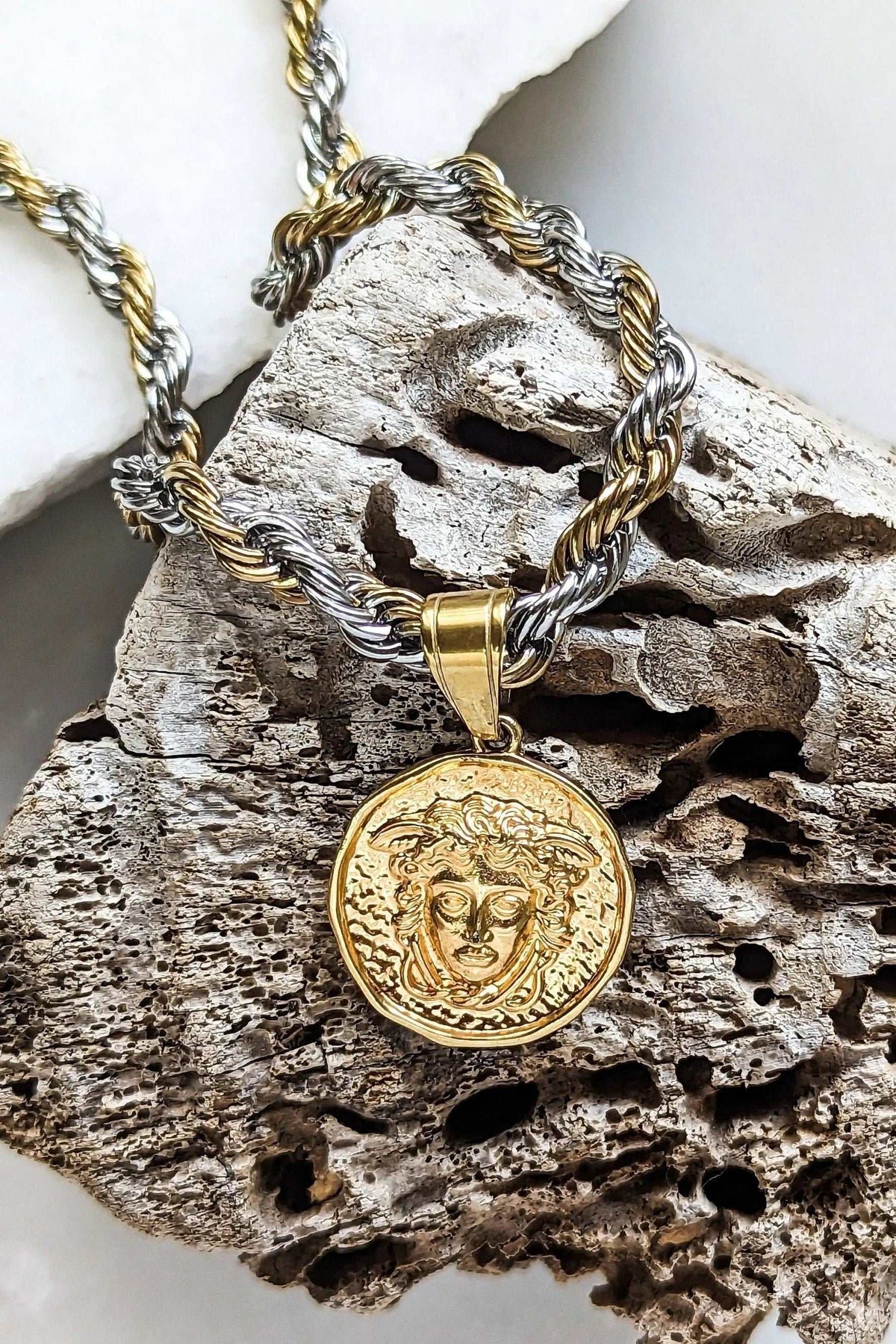 Medusa Chain Necklace with a twisted gold and silver cord chain, featuring a round gold coin pendant embossed with Medusa