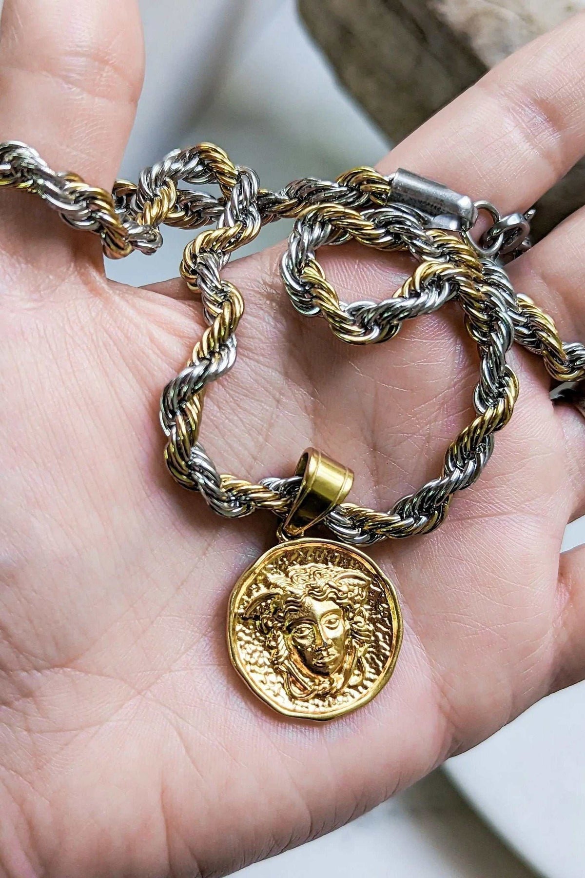 Medusa Chain Necklace with a twisted gold and silver-tone steel rope chain and round gold Medusa coin pendant