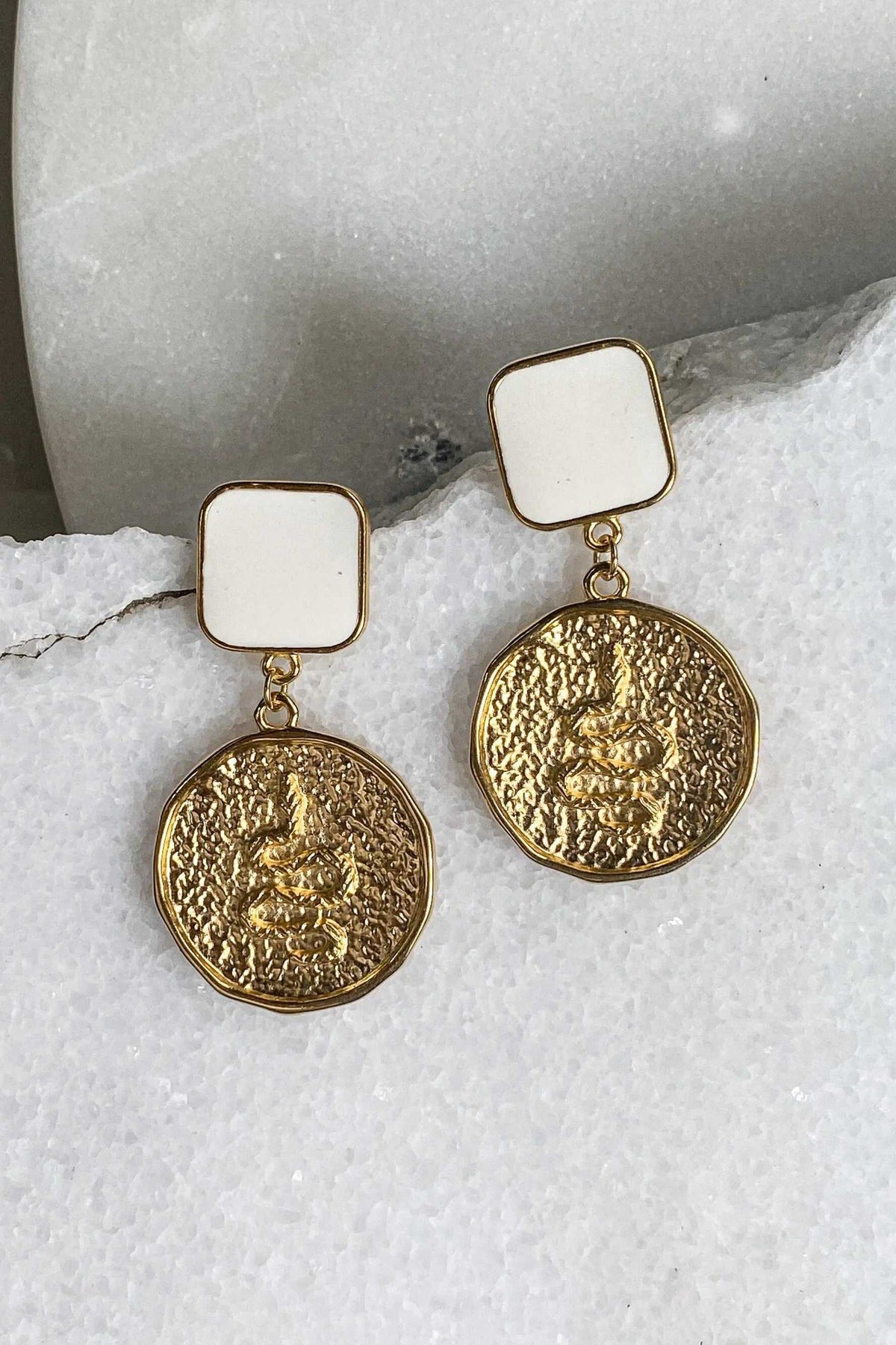 MEDUSA Gold Coin Earrings in gold-tone metal with square white tops and textured Medusa coin pendants