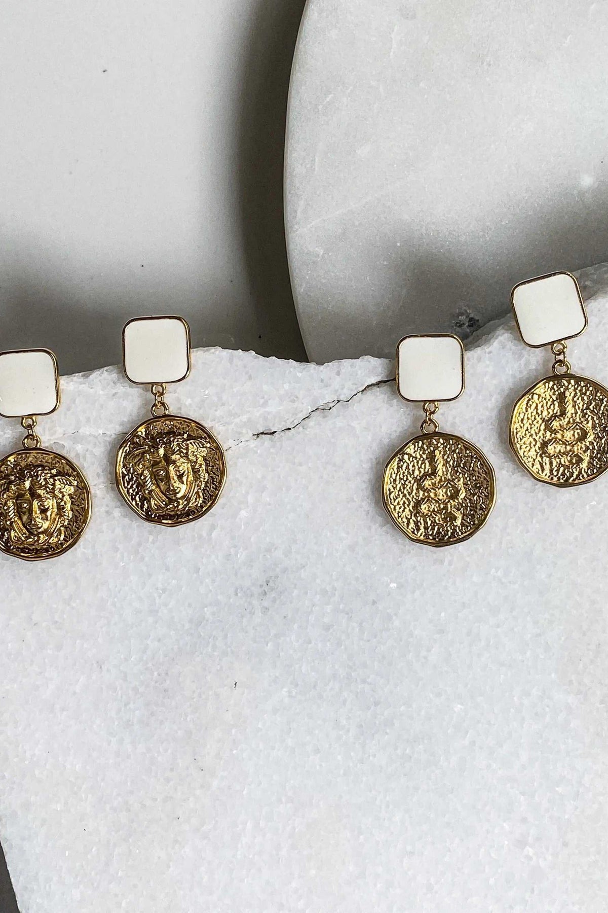 MEDUSA Gold Coin Earrings with gold-toned Medusa coin charms and cream square stud tops