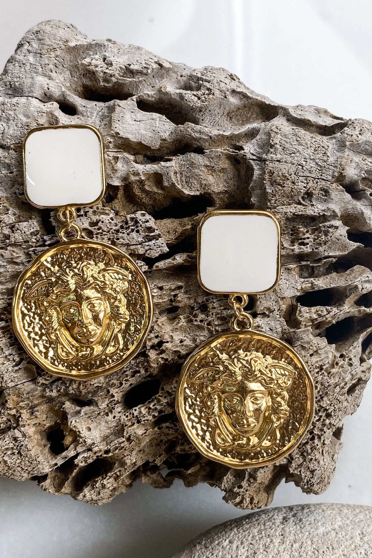 MEDUSA Gold Coin Earrings with ornate gold-tone Medusa faces, round embossed pendants and square white studs